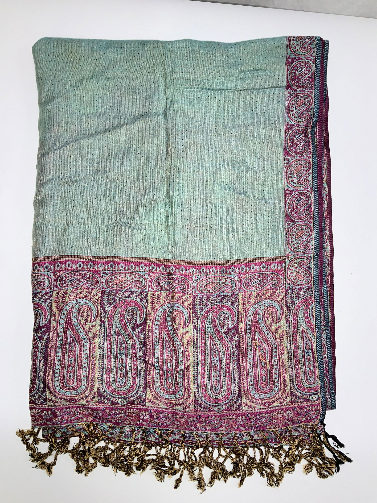 Rapti Cashmere Silk Blend Paisley Shawl: Pashmina Style Shawl with end tassels, 40% cashmere, 30% silk, 30% viscose. Teal green with fuchsia and aqua paisley border , other side all fuchsia. Measures 28.5 x 76 in. Minor puncture noted near b