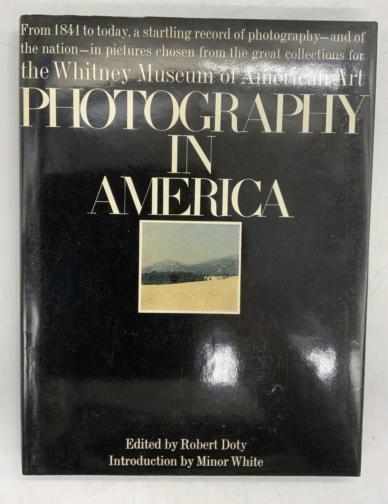 Photography in America, Book, Whitney Museum: Hardcover copy of photography in America edited by Robert Doty with introduction by Minor White. Published by Greenwich House, 1974. Measures approx. 9.25 x 12.25 inches. Wear to book jacket, cover, p