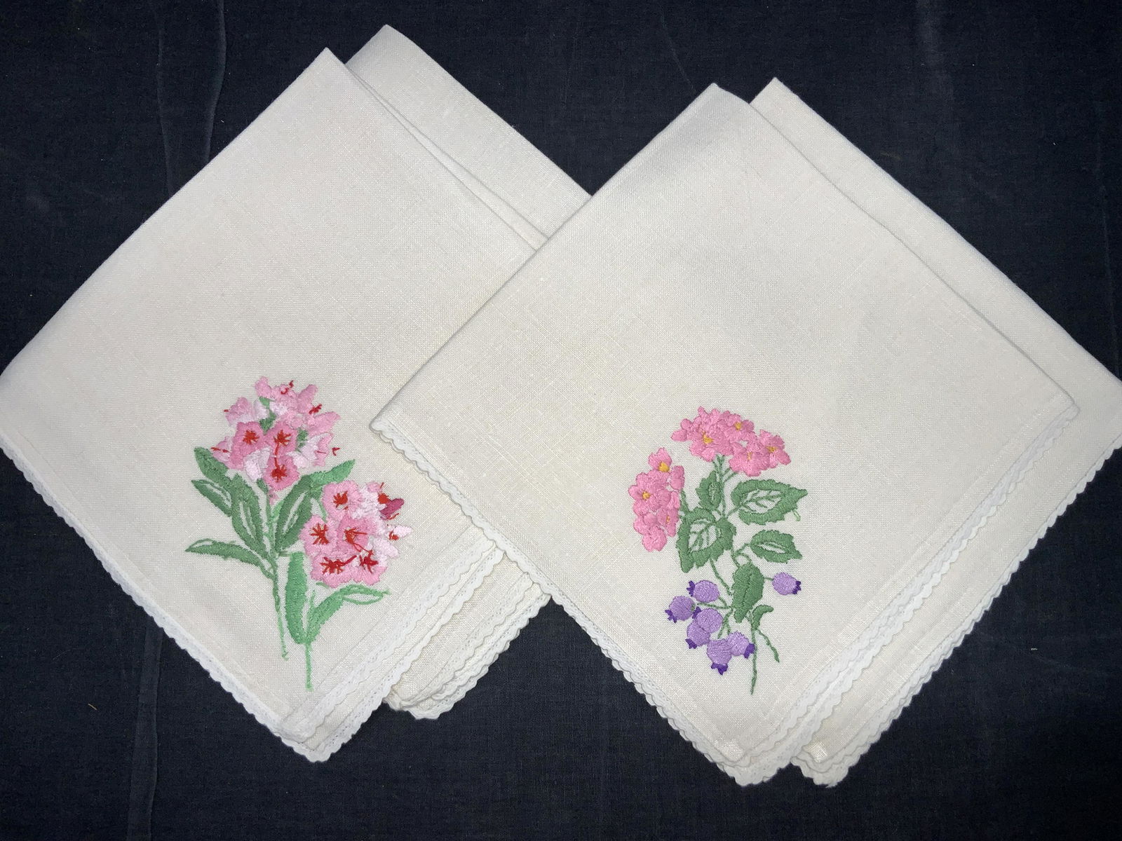 4 Vintage Embroidered Linen Hand Towels: Set of 4 vintage hand towels. Lace edges and embroidered with pink flowers with green leaves on corners. Approximately 18 x 17 inches. No evident blemishes, minor pulled threading. cleaned starched an
