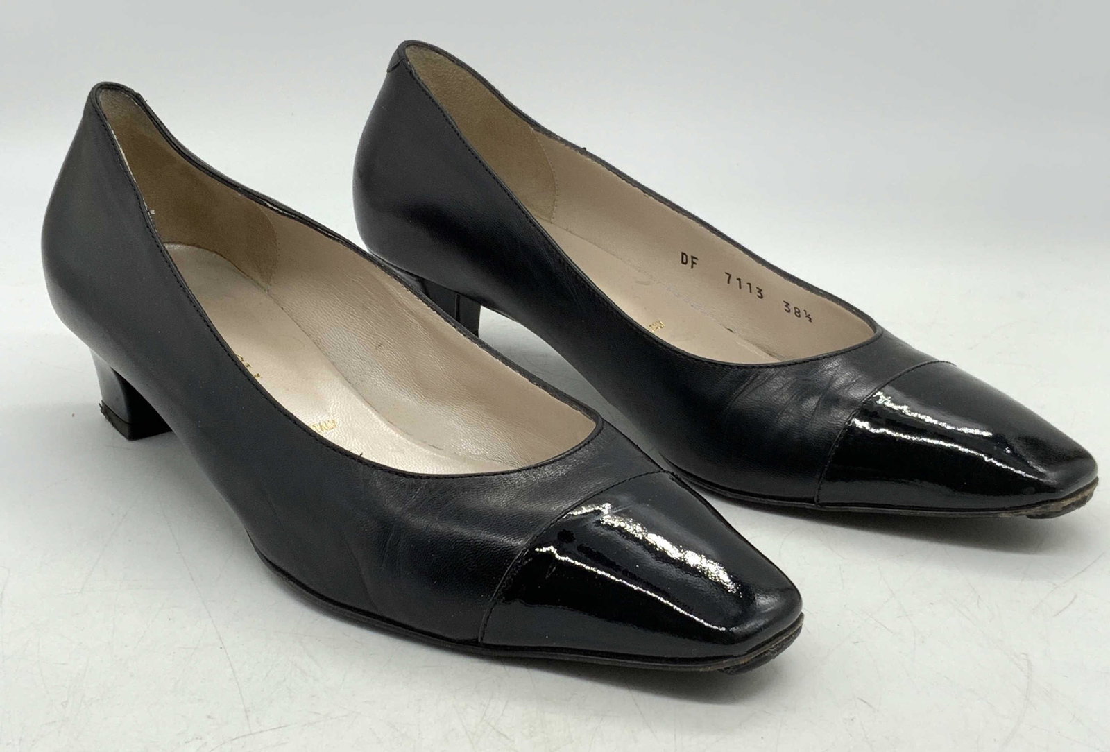 BRUNOMAGLI Black Leather Pumps: BRUNOMAGLI black leather pumps with patent leather detail. Size 38.5. Heel height approx. 1.75 inches. Some wear to leather and soles consistent with exposure. BRUNOMAGLI, BRUNOMAGLI shoes, ladies des