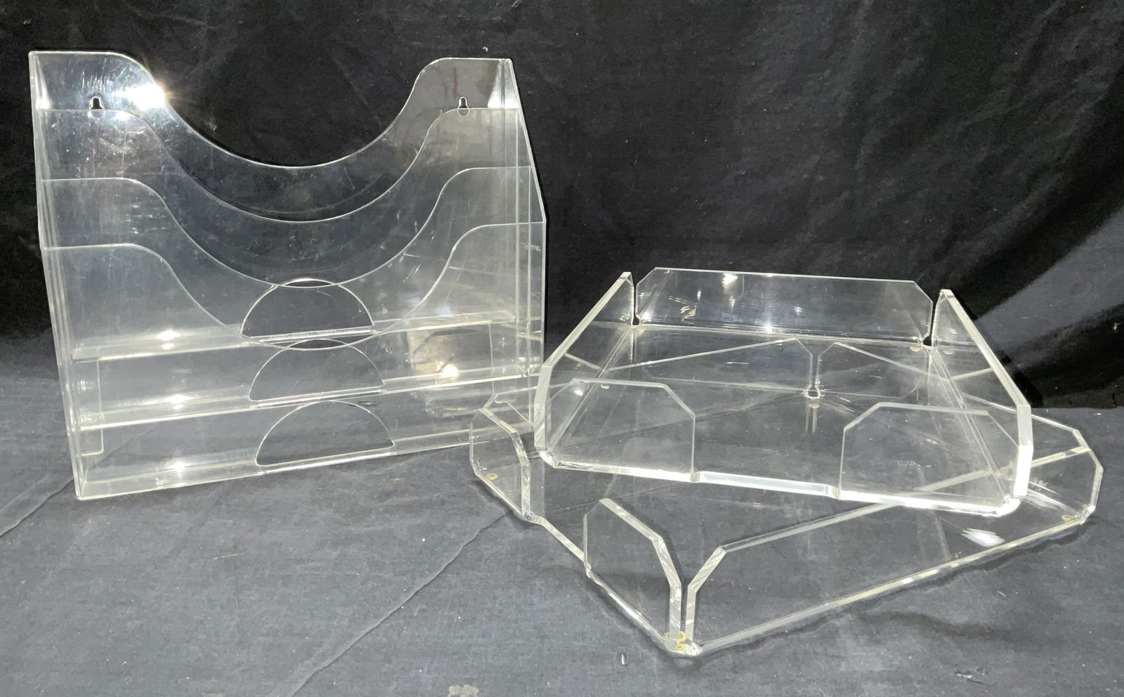 Lot 3 Lucite Paper Organizing Trays: Lot 3 Lucite Paper Organizing Trays. One rack to hang off wall & two paper desktop trays. Typical surface wear from prior use. Largest piece measures approx 13.25 x 11.5 x 3.5 inches. Lucite organizin