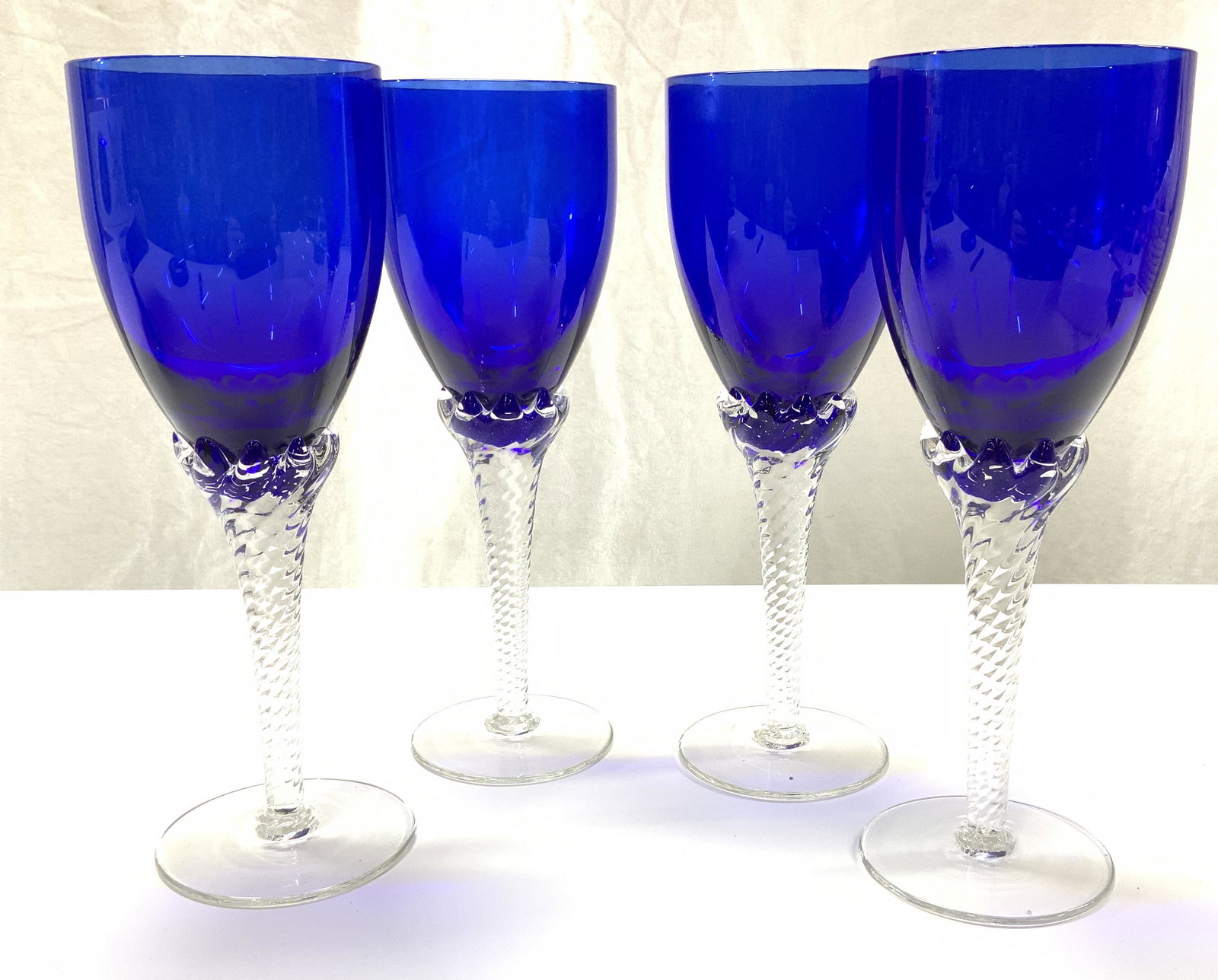 Set 4 Bohemian Style Cobalt Crystal Stemware: Hand blown stemware , clear crystal spiral stem and cobalt blue crystal goblet. Measure 9.25 in ht. , 3.5 in wide. Crystalware, Bohemian Style hand blown crystal stemware, Cobalt blue wine glasses, Ha