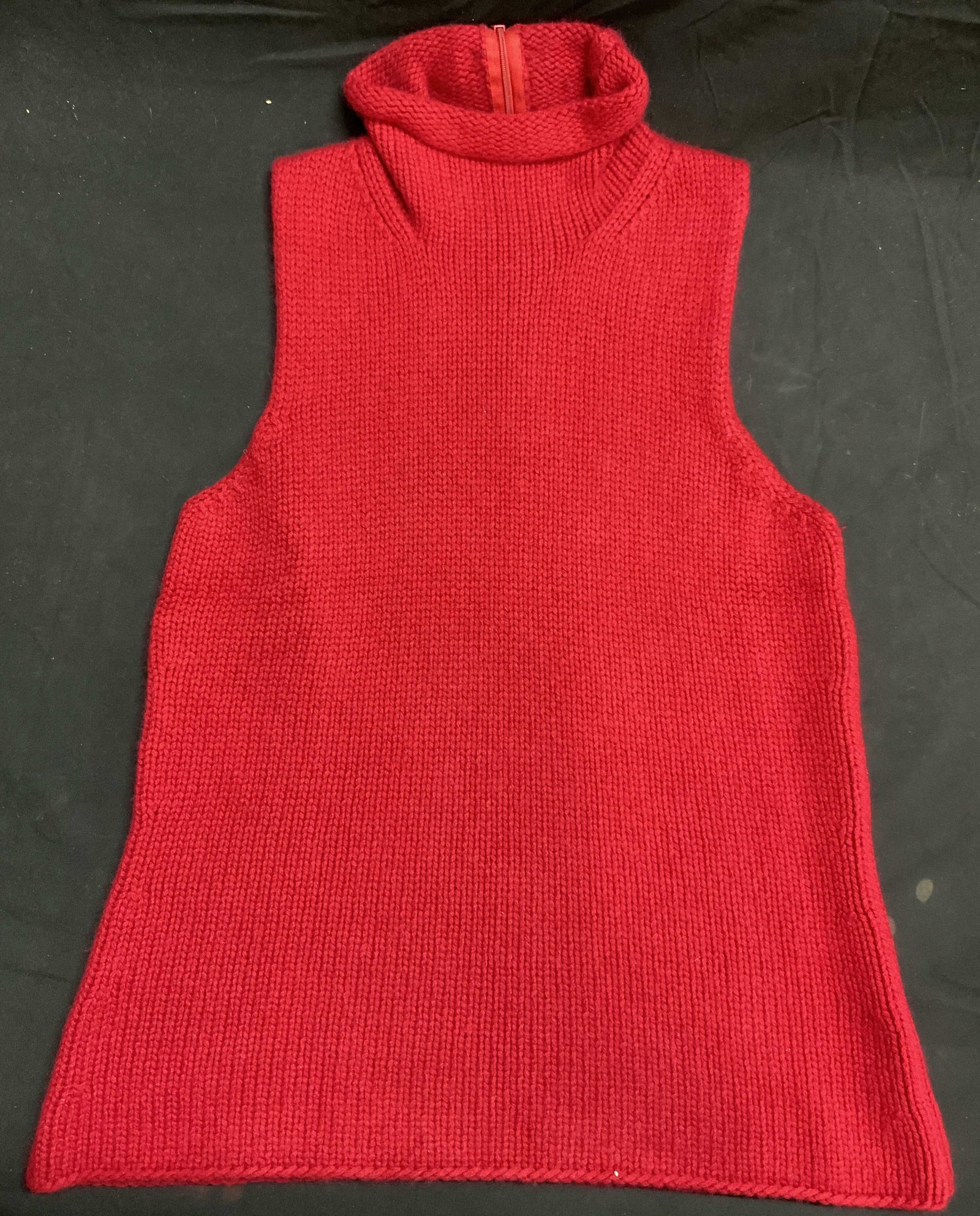 MAC Red Knit Cashmere Sleeveless Turtleneck: MAC red knit cashmere sleeveless turtleneck. Measures approx. 16 inches across chest. Gently worn. Label stitcher to seam. MAC sweater, mac knitwear, ladies designer sweater, ladies designer turtlenec
