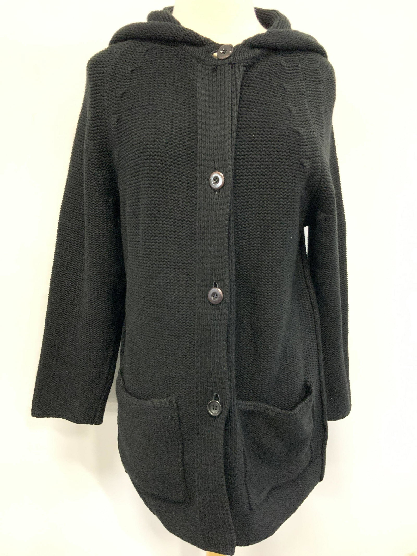 N.PEAL Size 42 Knitted Cashmere Button Up Cadigan: Marked N.Peal on Tag. cashmere. size 42. Black toned knitted with wooden buttons a hood with wide sleeves. Minor pulled threading. N.Peal Designer Cardigan, Designer cardigan, knit ware, knit cardigan