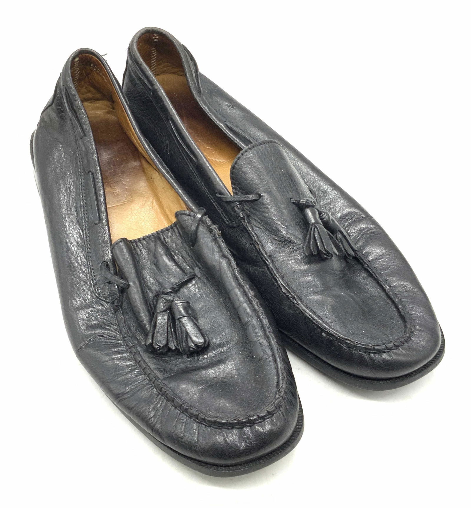 POULSON SKONE & CO Black Leather Loafers: Black leather loafers. Interior is brown hued and marked POULSON SKONE & CO. Underside marked 44. Some surface wear consistent with use and storage. Wearables, POULSON SKONE & CO shoes, POULSON SKONE