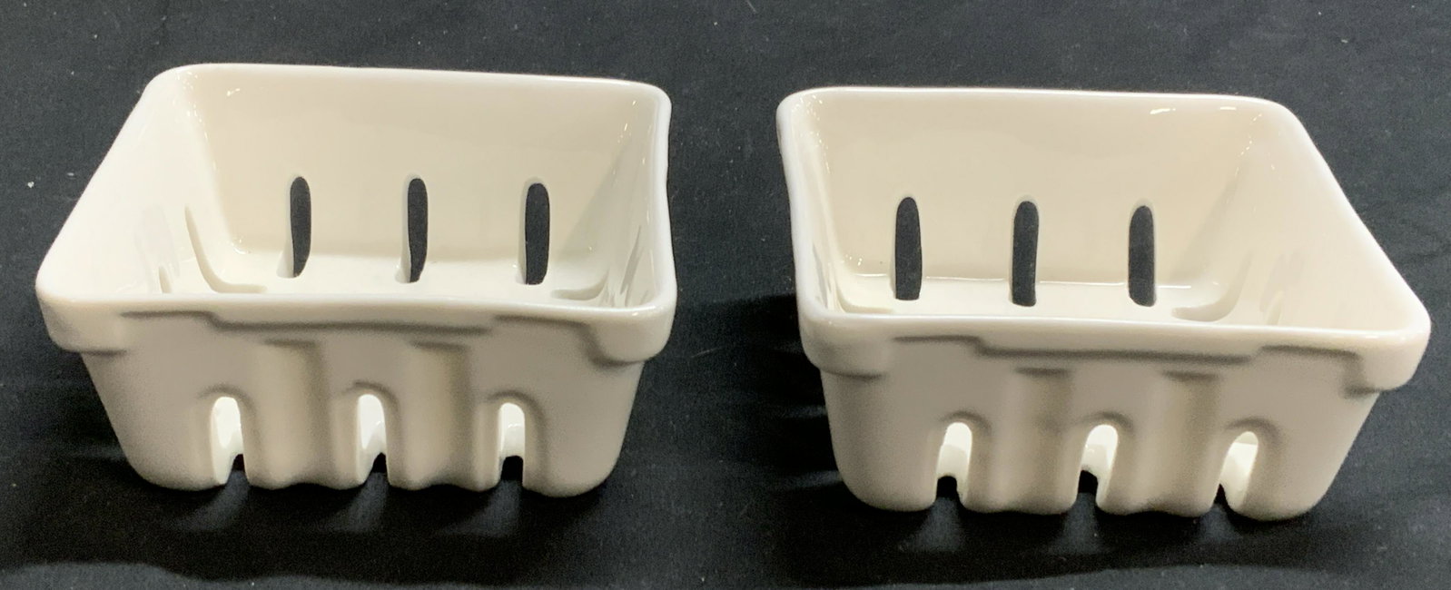 Pair ROOST White Ceramic Square Baskets: Pair of Roost white ceramic square form baskets. Measures approx. 3.75 x 3.75 x 1.5 inches each. Trademarked to undersides. Both pieces in good condition. Roost, roost basket, ceramic basket, table de