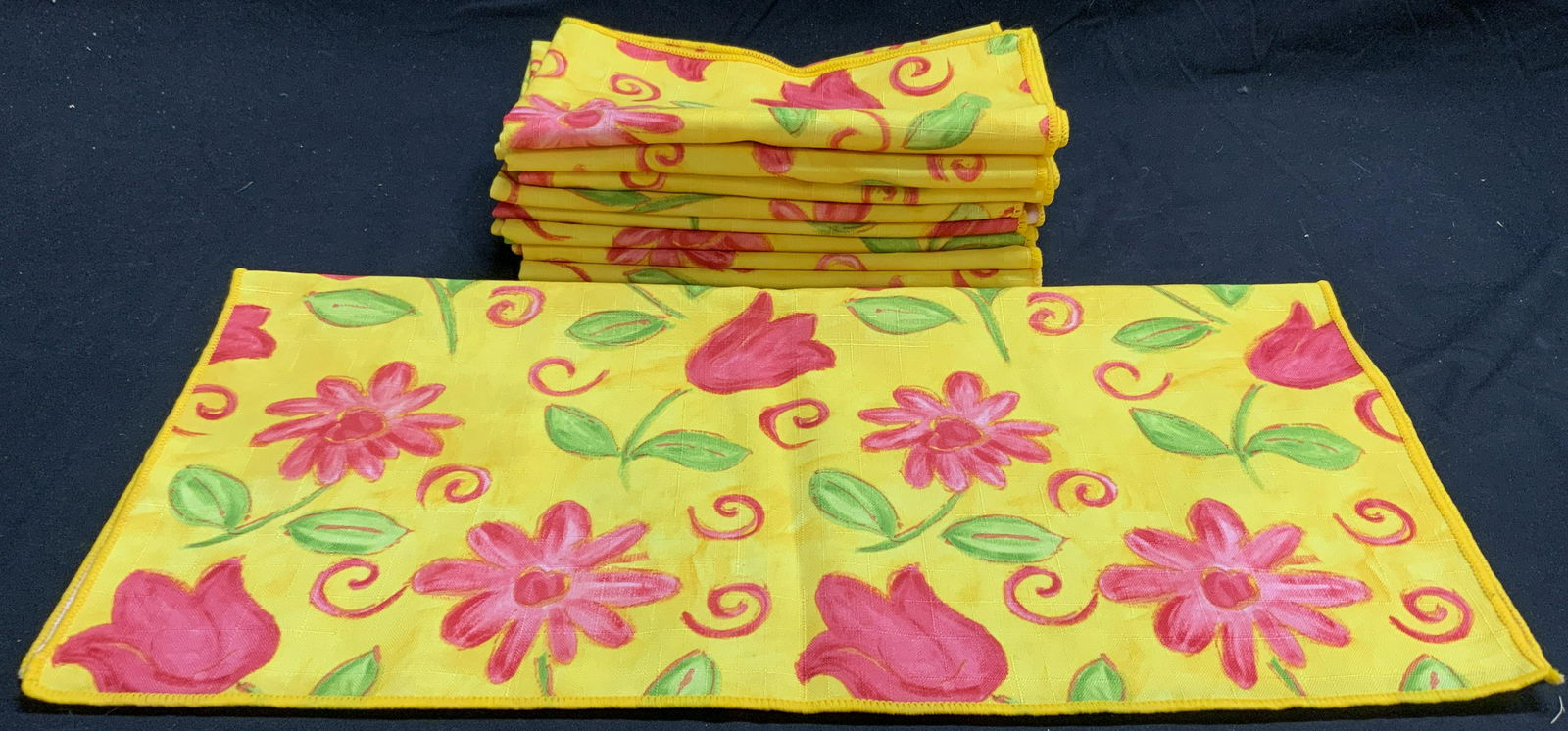 Set 9 Yellow Floral Cloth Napkins: Set of 9 yellow cloth napkins with pink floral motif. Some blemishes to all pieces. Material feels like cotton. Measure approx. 17.5 x 17.5 inches each. Napkins, cloth napkins, cocktail napkins, table