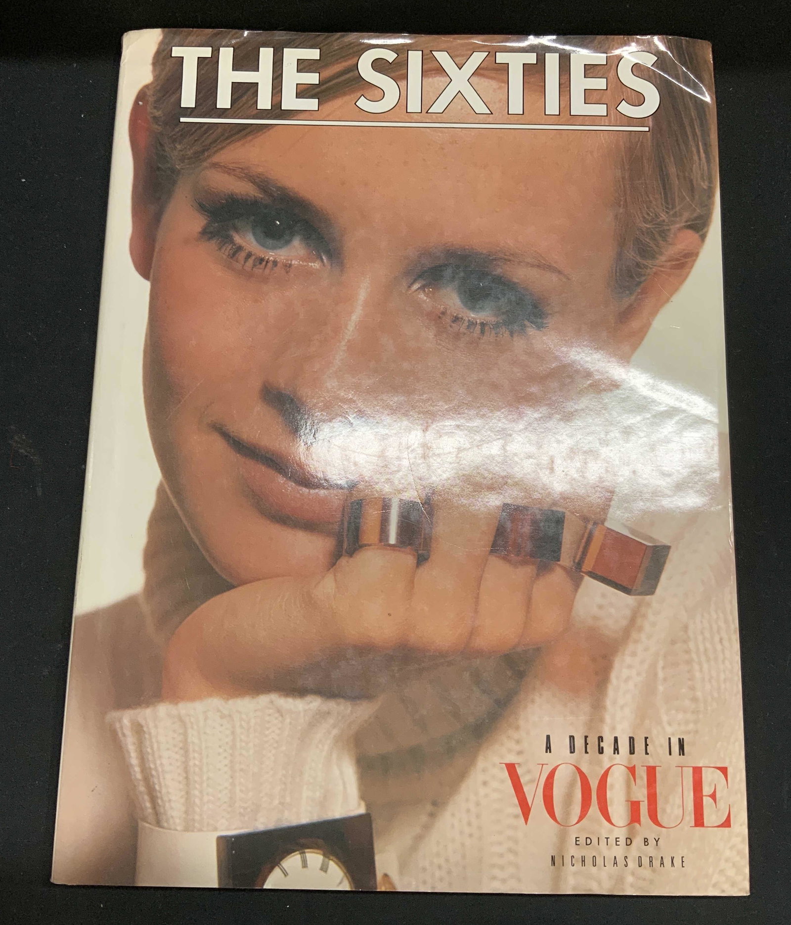 The Sixties A Decade In Vogue Book: Hardcover copy of The Sixties: A Decade in Vogue edited by Nicholas Drake. Published by Prentice Hall Press, 1988. First edition. Wear to book jacket, cover, pages, and spine consistent with exposure.