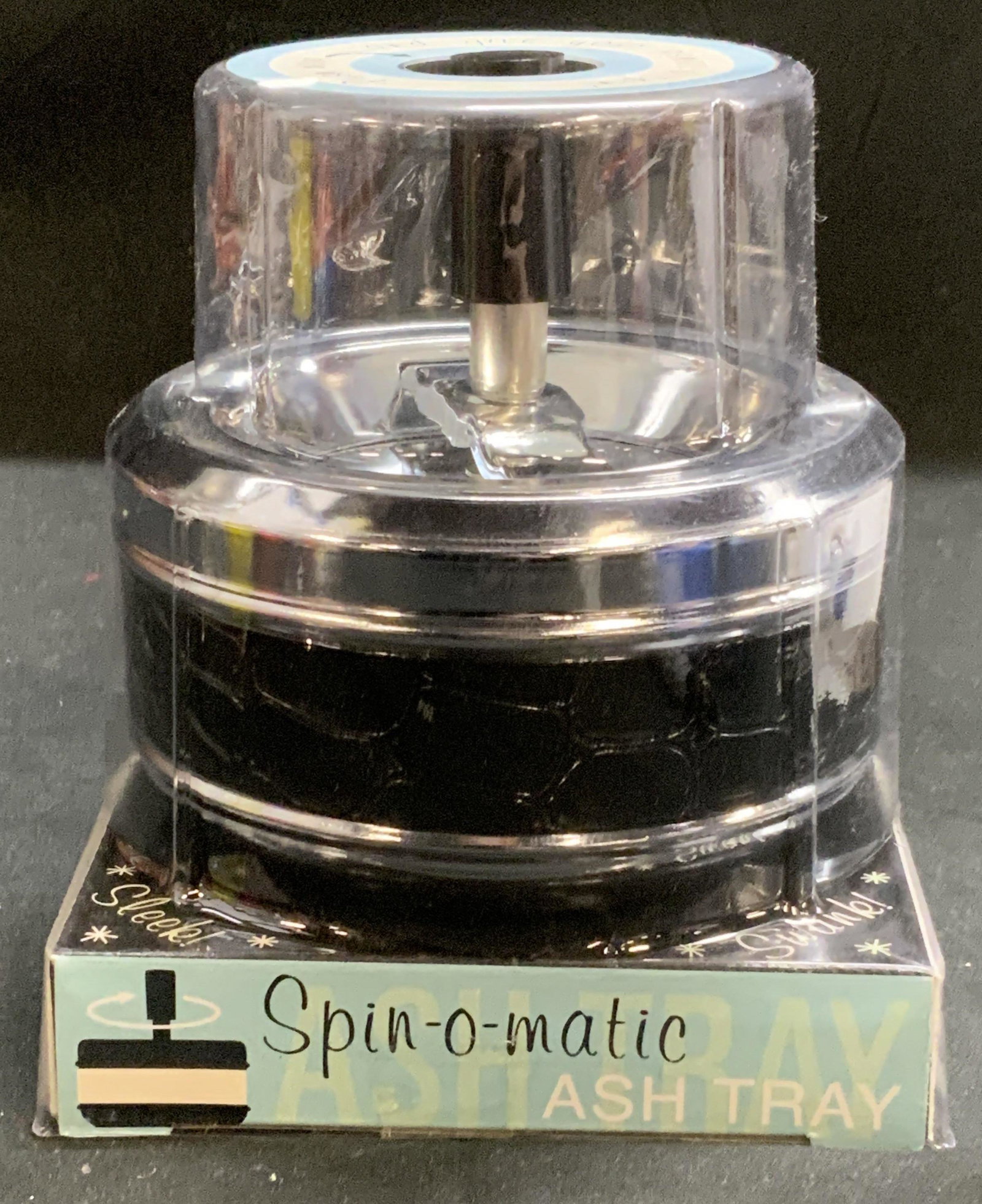 Accoutrements Spin O Matic Ash Tray New in Package: Accoutrements Spin O Matic spinning ashtray. New in package. Measures approx. 4.5 inches diameter and 5.25 inches tall. Spin o Matic, spinning ashtray, ashtray, retro style ashtray, tobacco accessorie