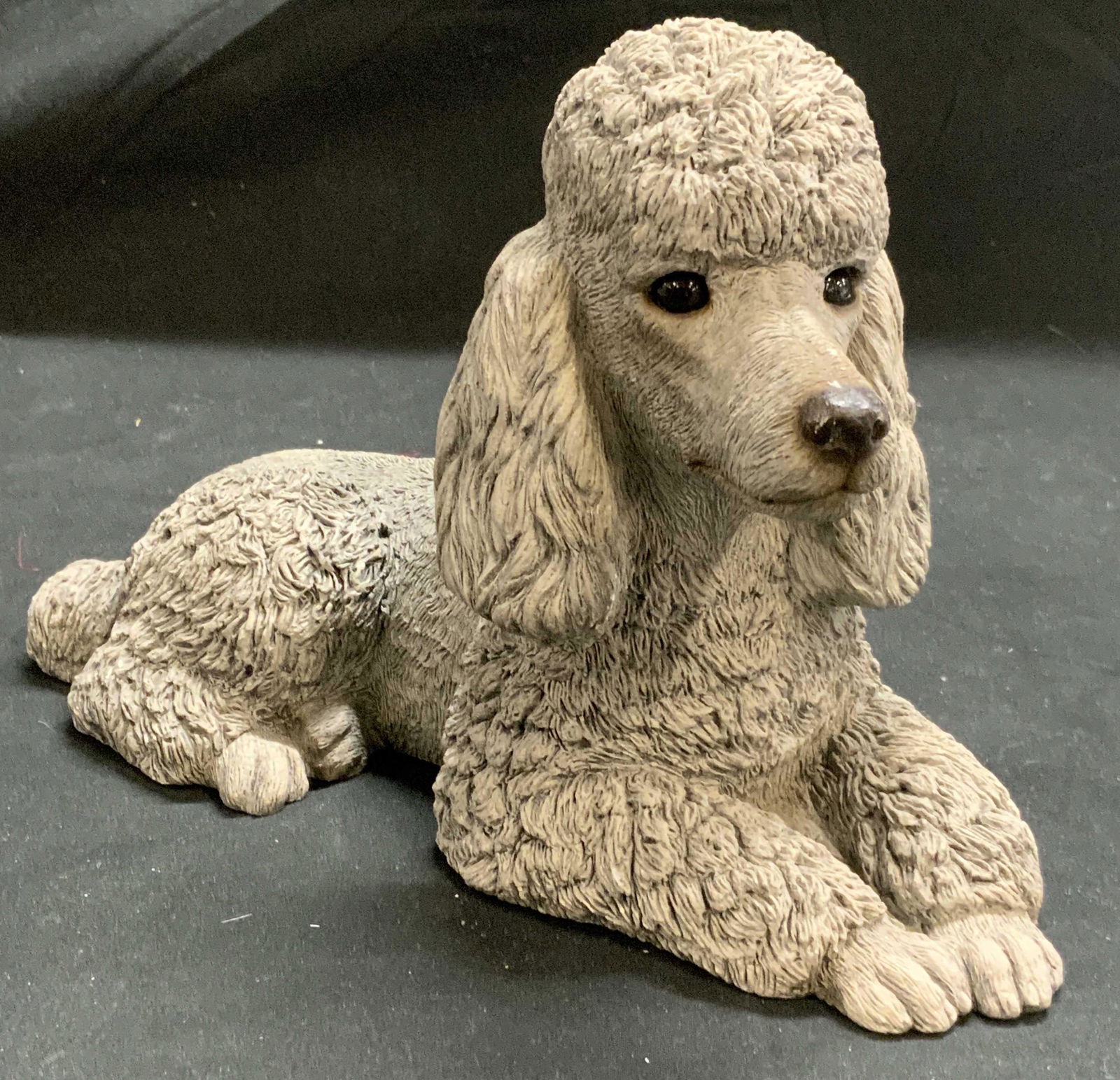 SANDICAST Silver Poodle Figural Signed S. Brue: SANDICAST silver poodle figural sculpture signed Sandra Brue to underside. Composed of stone and resin. In good condition, minor surface wear present. Measures approx. 9.25 x 4 x 6 inches. Piece has w