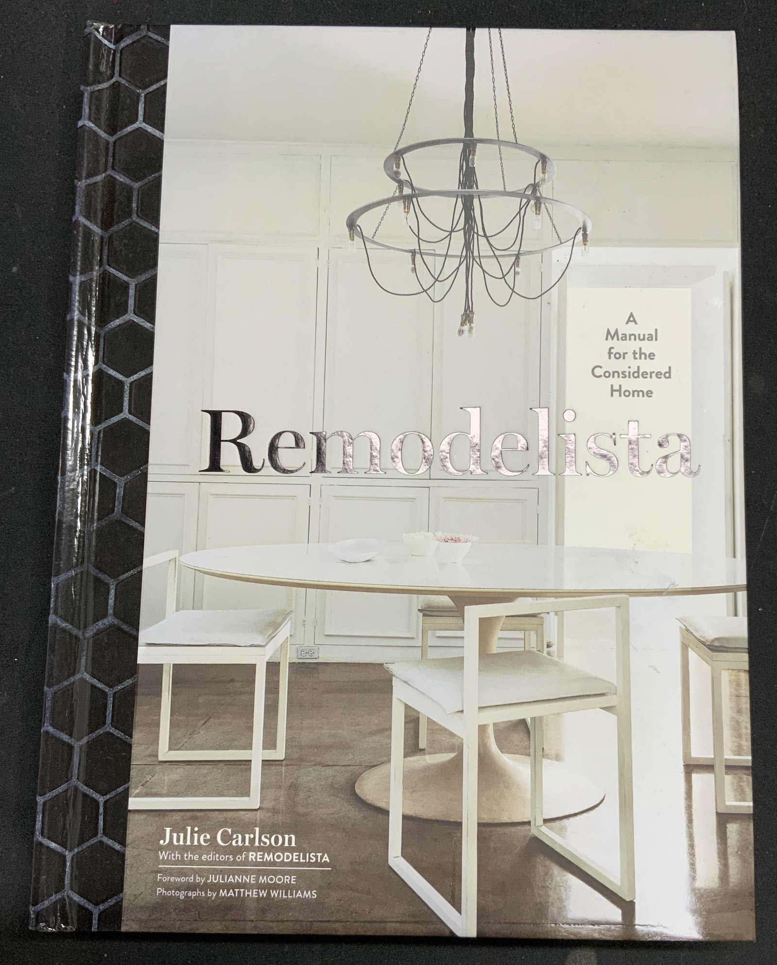 Remodelista by Julie Carlson, Design Book: Hardcover copy of Remodelista: A Manual Considered for the Home by Julie Carlson. Published by Artisan, 2016. Some wear to cover, pages, and spine consistent with exposure. Measures approx. 7.75 x 10.