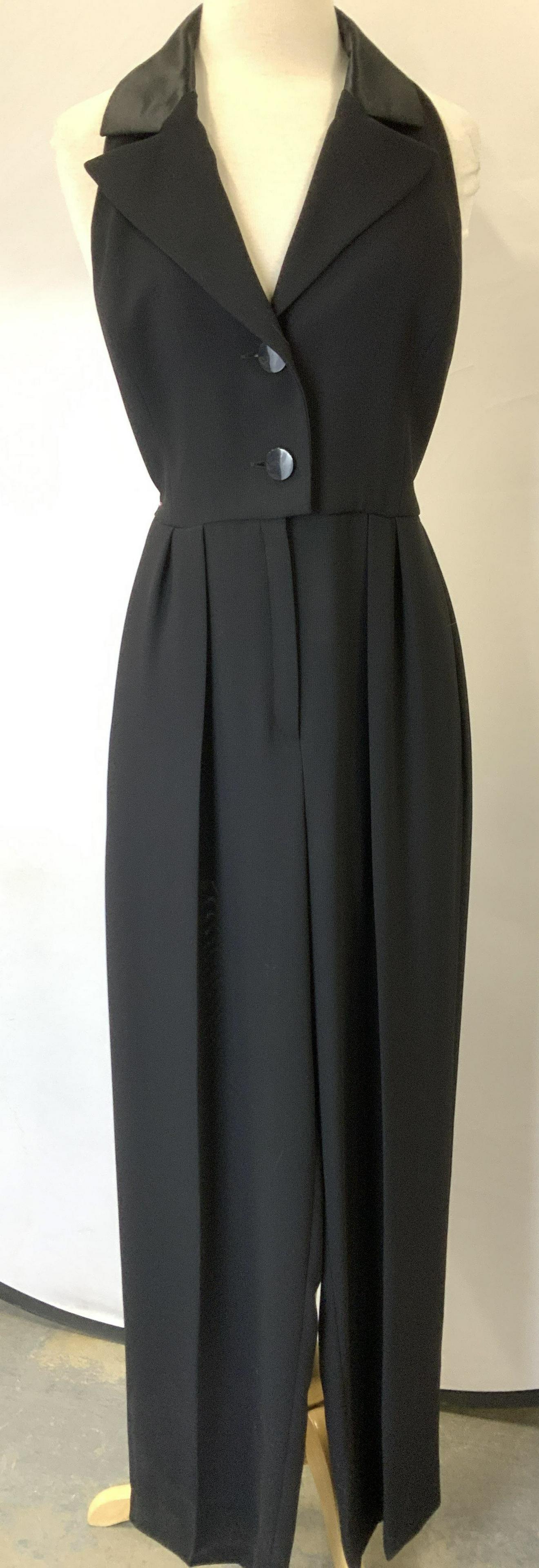 Yves Saint Laurent Jumpsuit Halter , France: Yves Saint Laurent black polyester Halter jumpsuit, ladies size 8, tuxedo shawl collar, plunging V neck with 2 buttons. Leg length 42.25 in. Inseam 27.5 in. L Semi sheer fabric. Satin cummerbund label