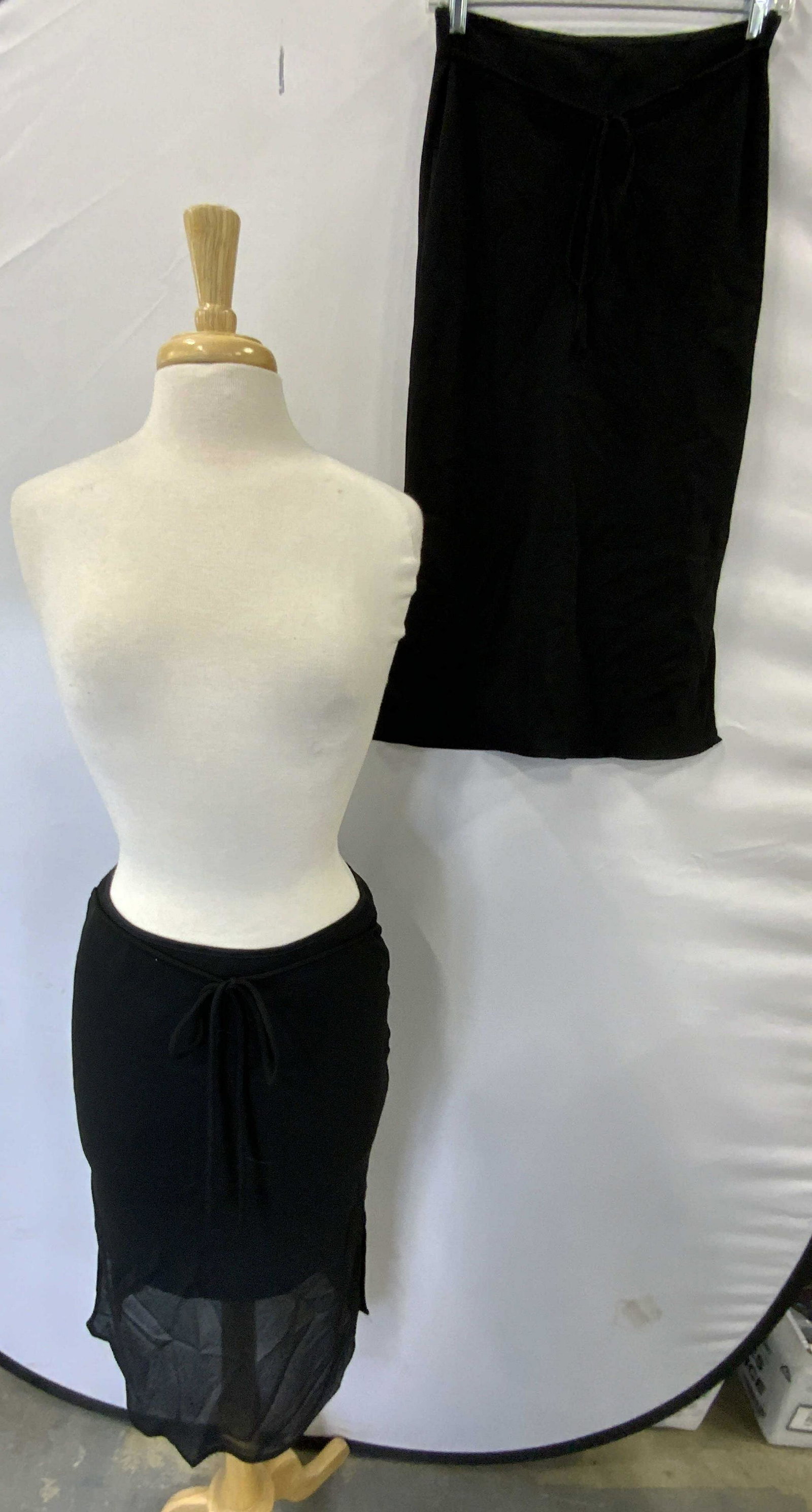 Lot 2 NOVA Black Midi Skirts, Med & Lrg: Lot of 2 Nova black skirts with tie waists. Sizes medium and large. Both pieces gently worn. Both pieces 100% polyester. Nova, nova skirt, ladies designer skirt, ladies designer midi skirt, ladies des