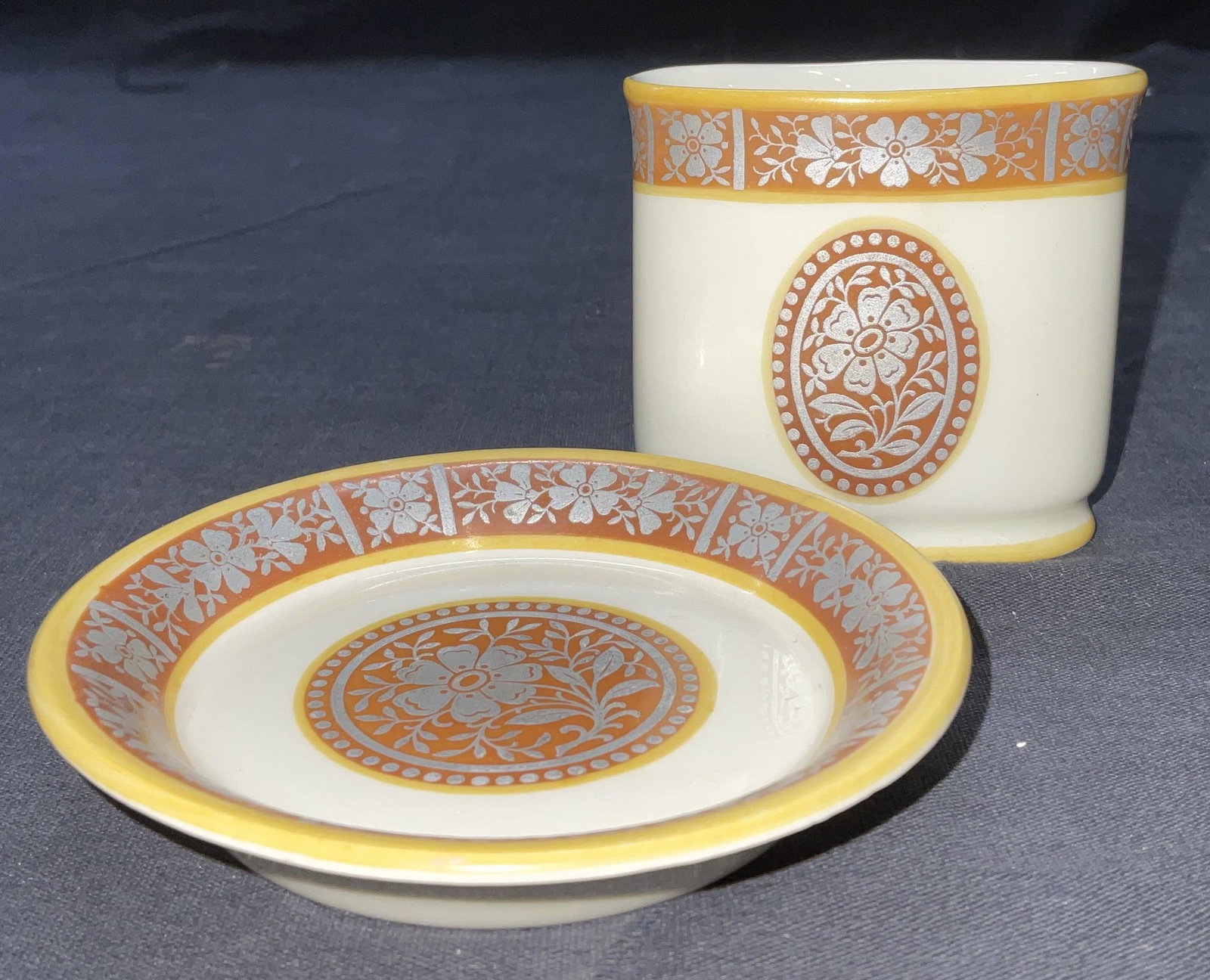 Eisenbach Bavaria Elfenbein Porc. Cigarette Holder: Eisenbach Bavaria Elfenbein Porc. Cigarette Holder & Ash tray. Holder measures approx 2.5 x 2 5/8 x 1 3/8 inches. Ash tray dish measures 3 5/8 In diameter. Minor chip to glaze on cigarette holder (see