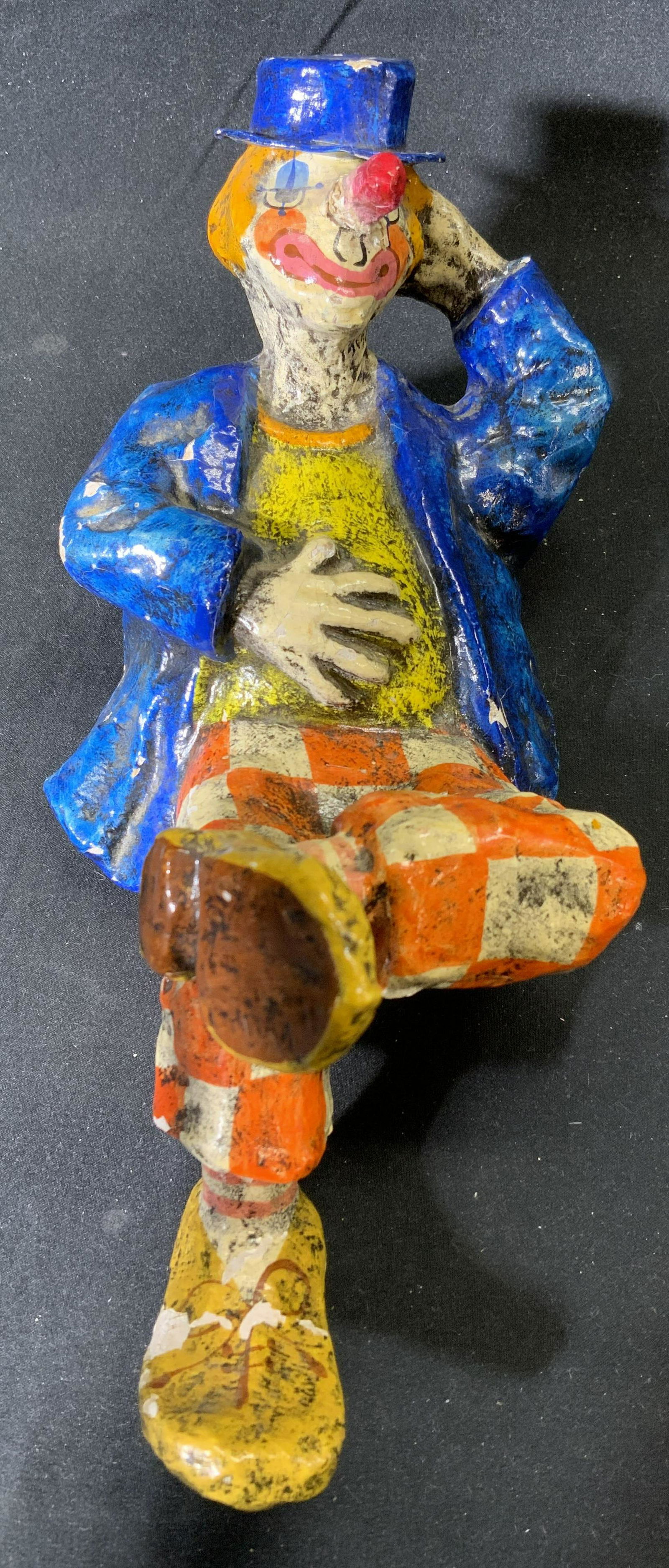 Vintage Papier-mache Reclining Clown Figural: Vintage papier Mache reclining clown figural. Surface wear consistent with exposure, chipping. Measures approx. 11 x 4.5 x 4.5 inches. Clown, vintage clown, clown figural, clown decor, clown sculpture