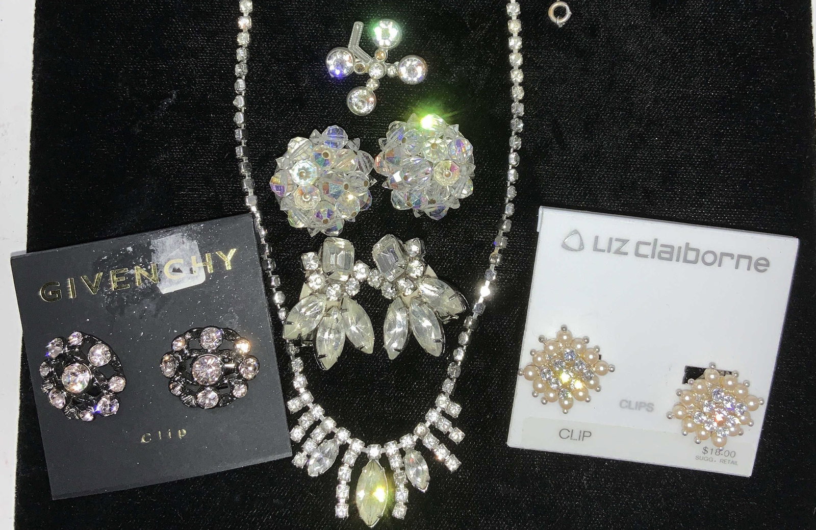 Art Deco Rhinestone & Crystal Jewelry, Lot 6 NIP: 4 pairs of clip on earrings, including new old stock on original packaging . Liz Claiborne crystal and fair pearl earrings , .75 in. Givenchy pink crystal clip in earrings, 7/8 in. Aurora Borealis bea