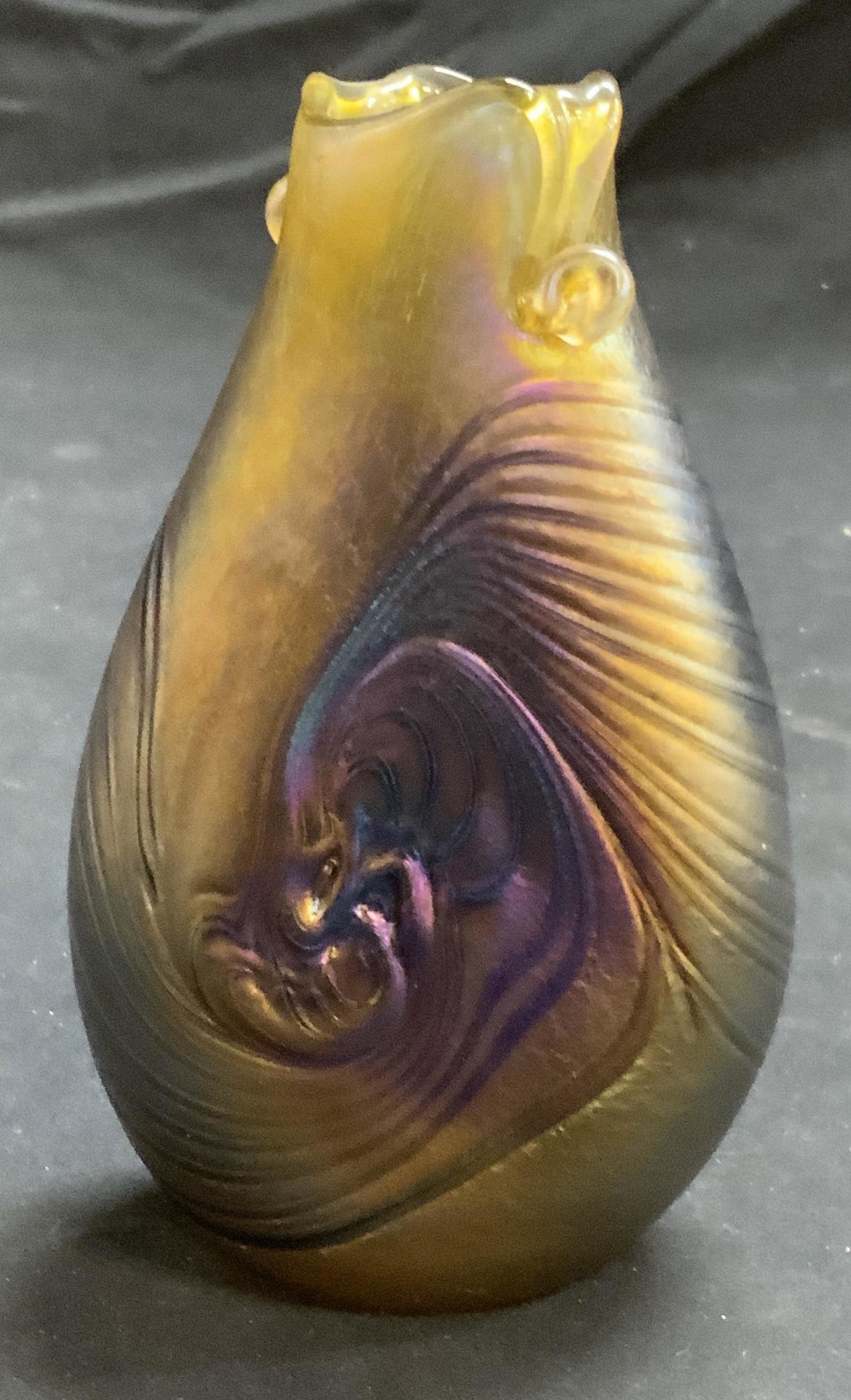 Signed HAT Carnival Glass Bud Vase: Signed HAT carnival glass Bud vase. Measures approx. 3 x 1.5 x 5.25 inches. Signature etched at base. In good condition. Carnival glass, art glass, carnival glass vase, art glass vase, studio glass, i