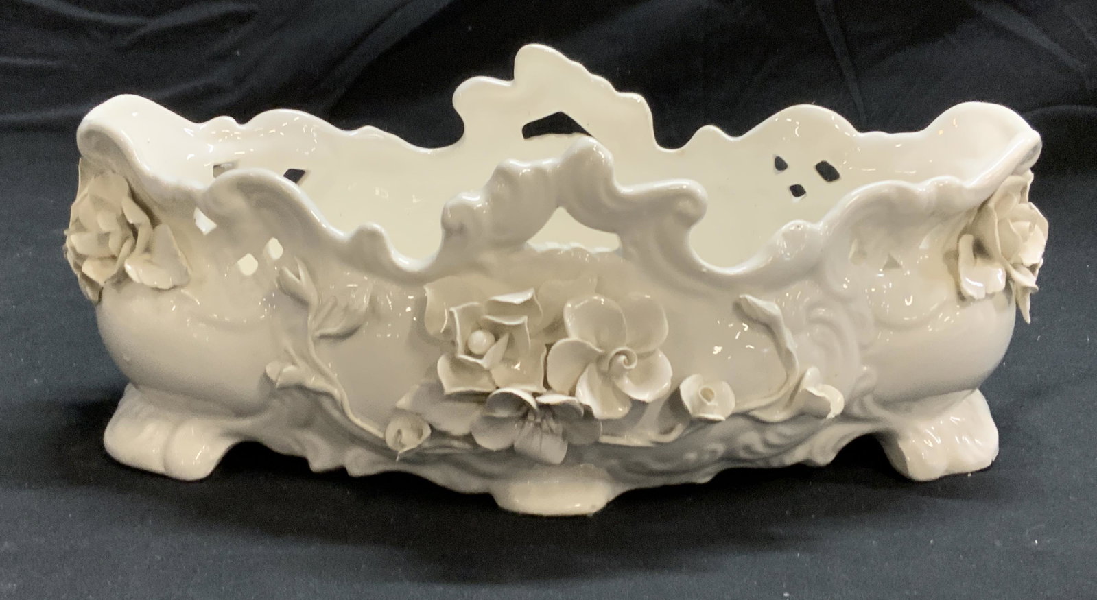 Vintage White Floral Porcelain Bowl, Italy: Vintage white porcelain bowl with floral relief. Marked made in Italy to underside. Measures approx. 11 x 7 x 4.25 inches. In good condition. Porcelain bow, white porcelain bowl, porcelainware, table 