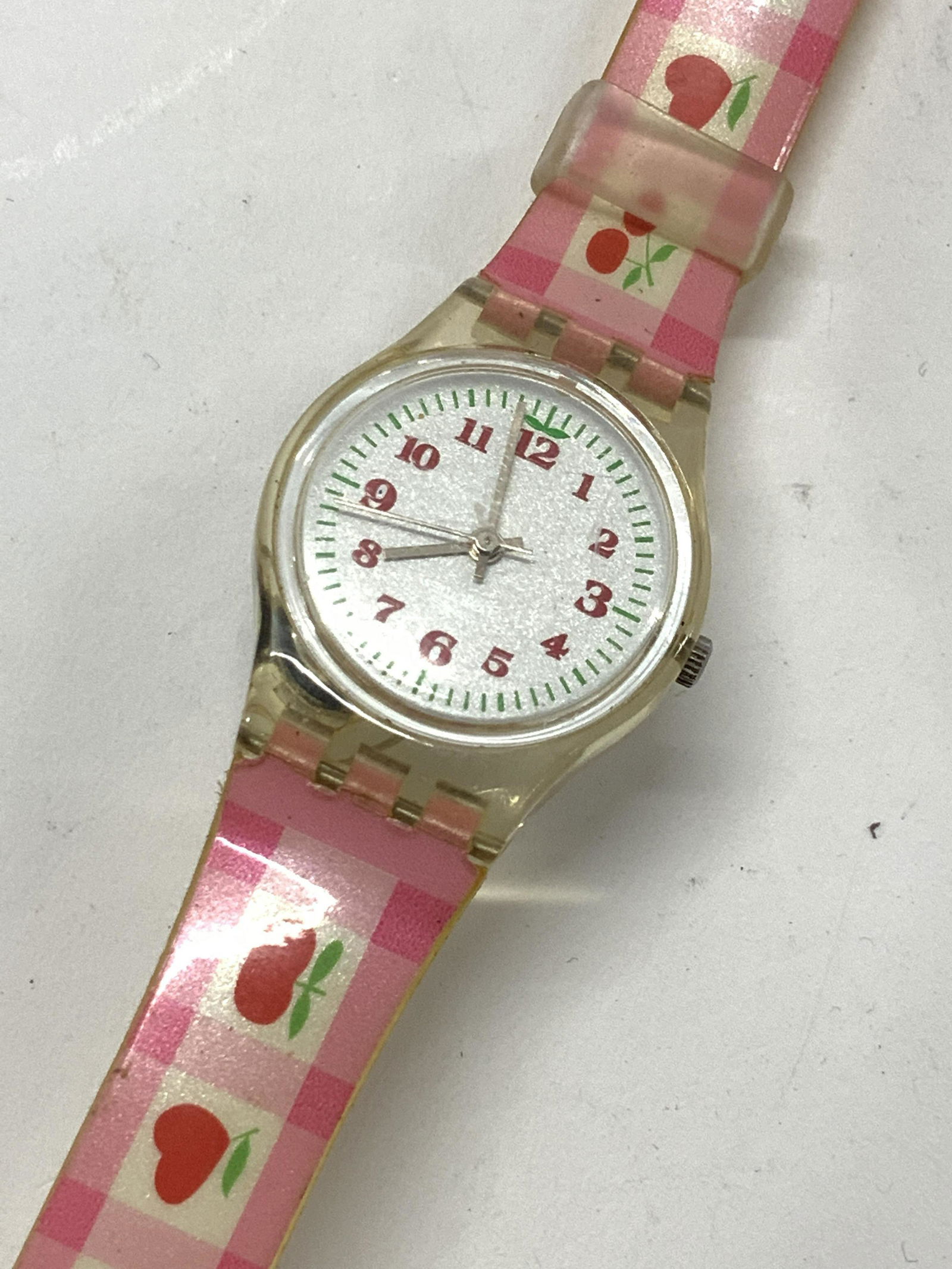 Vintage Fashion Swatch Wristwatch: Fun fashion watch, singed Swatch in buckle, pink, red and white with fruit print on band. Not tested for working condition, 8 in long. Swatch watch, vintage c. 1980s Swatch Wristwatch, Jewelry accesso