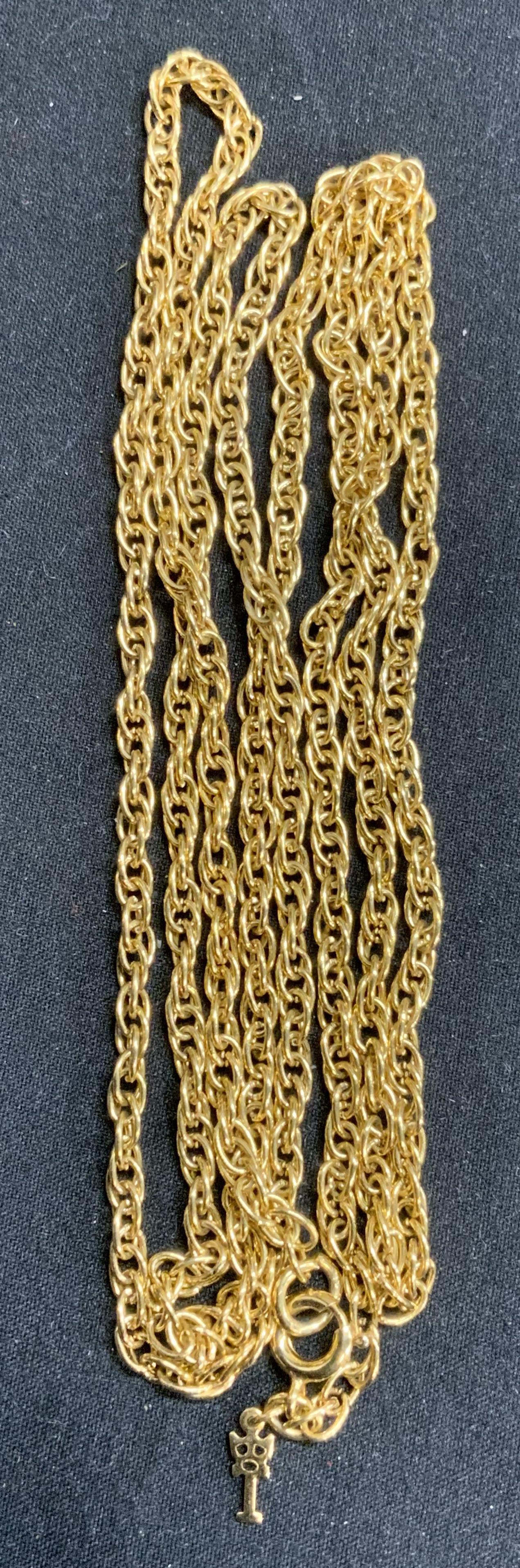TRIFARI Gold Tone Chain Necklace, Jewelry: Trifari gold tone chain necklace. Designer label to charm. Measures approx. 36 inches long. In good condition. Property of Palm Beach, Florida Estate. Estate jewelry, costume jewelry, cocktail jewelry