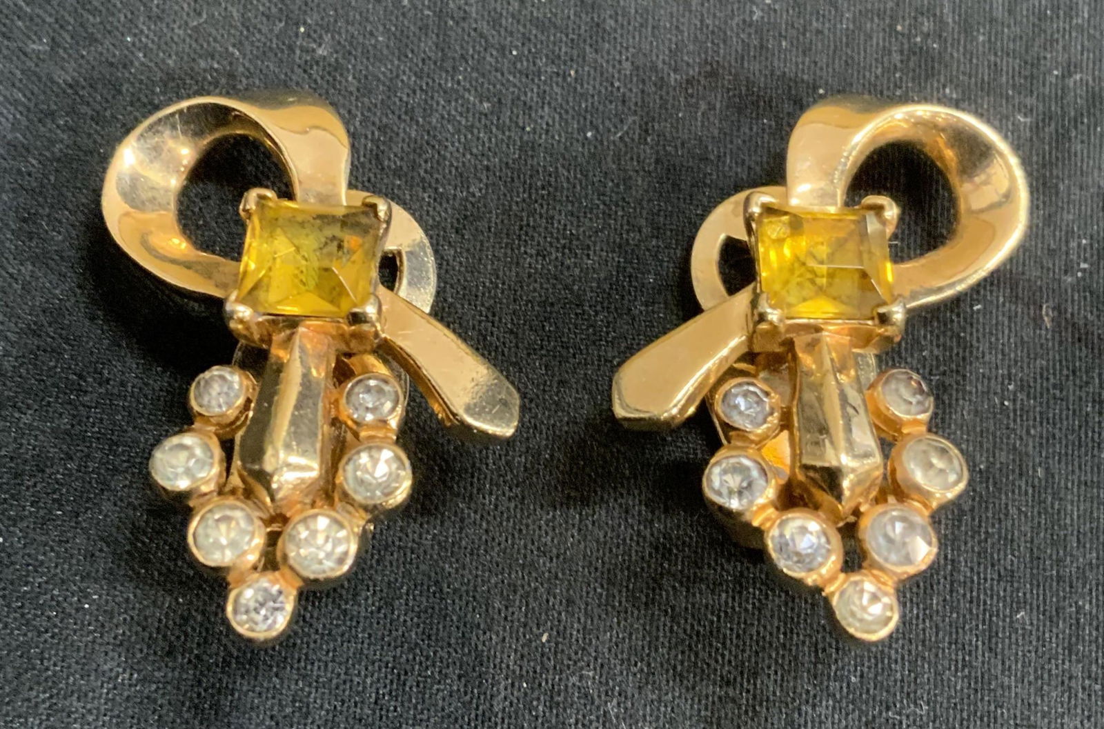 MAZER Gold Tone Crystal Clip On Earrings, Jewelry: Mazer gold tone crystal clip on earrings with bezel set yellow and colorless faceted crystals. Measure approx. 1 x .75 inches. Designer label to backings. In good condition. Property of Palm Beach, Fl