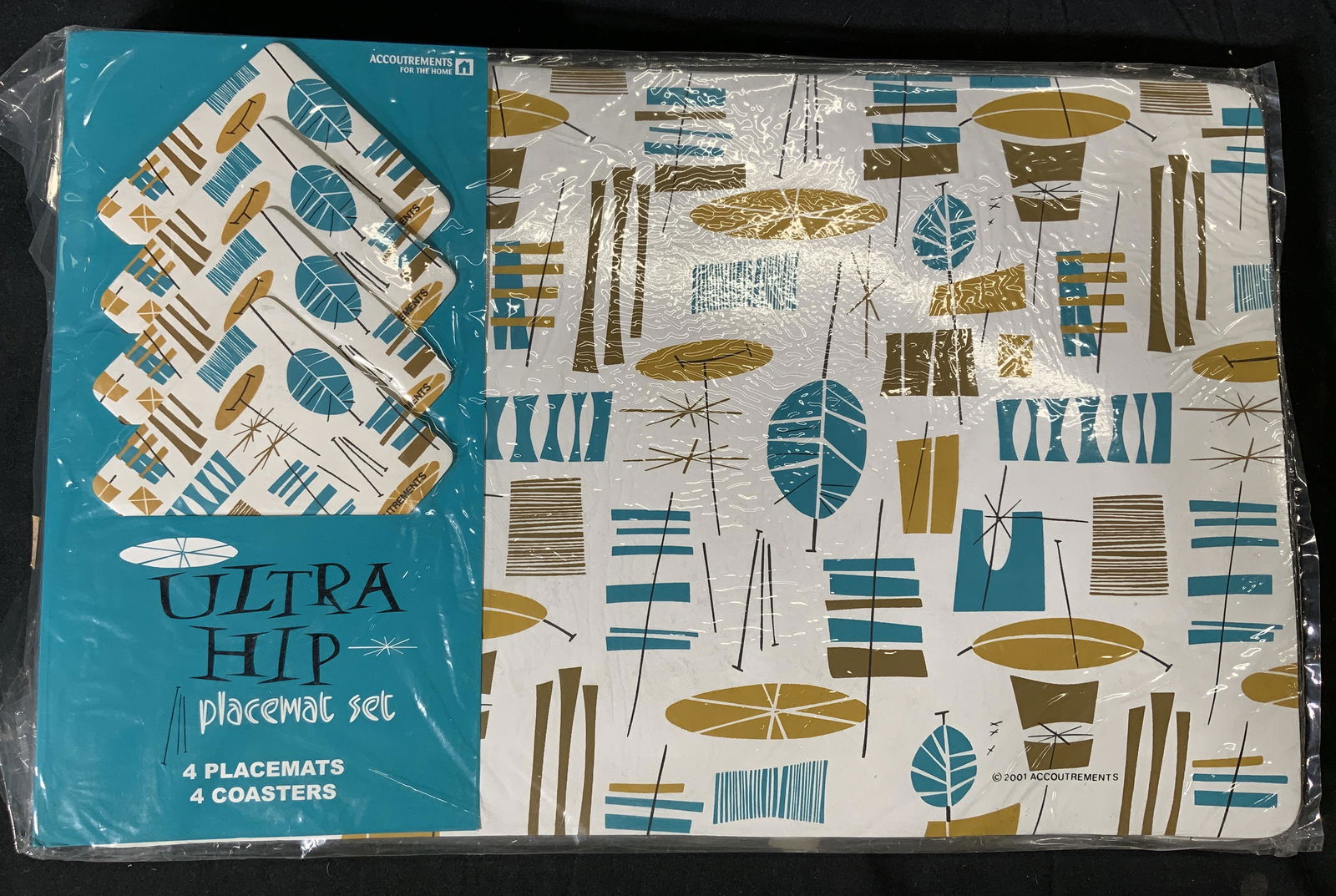 Set 3 Accoutrements Ultra Hip Placement Sets NIP: Set of 3 vintage Accoutrements Ultra Hip mid century modern style placemat sets. Each set includes 4 placemats and 4 coasters. 24 pieces total. All new in original packaging. Placemats measure approx.