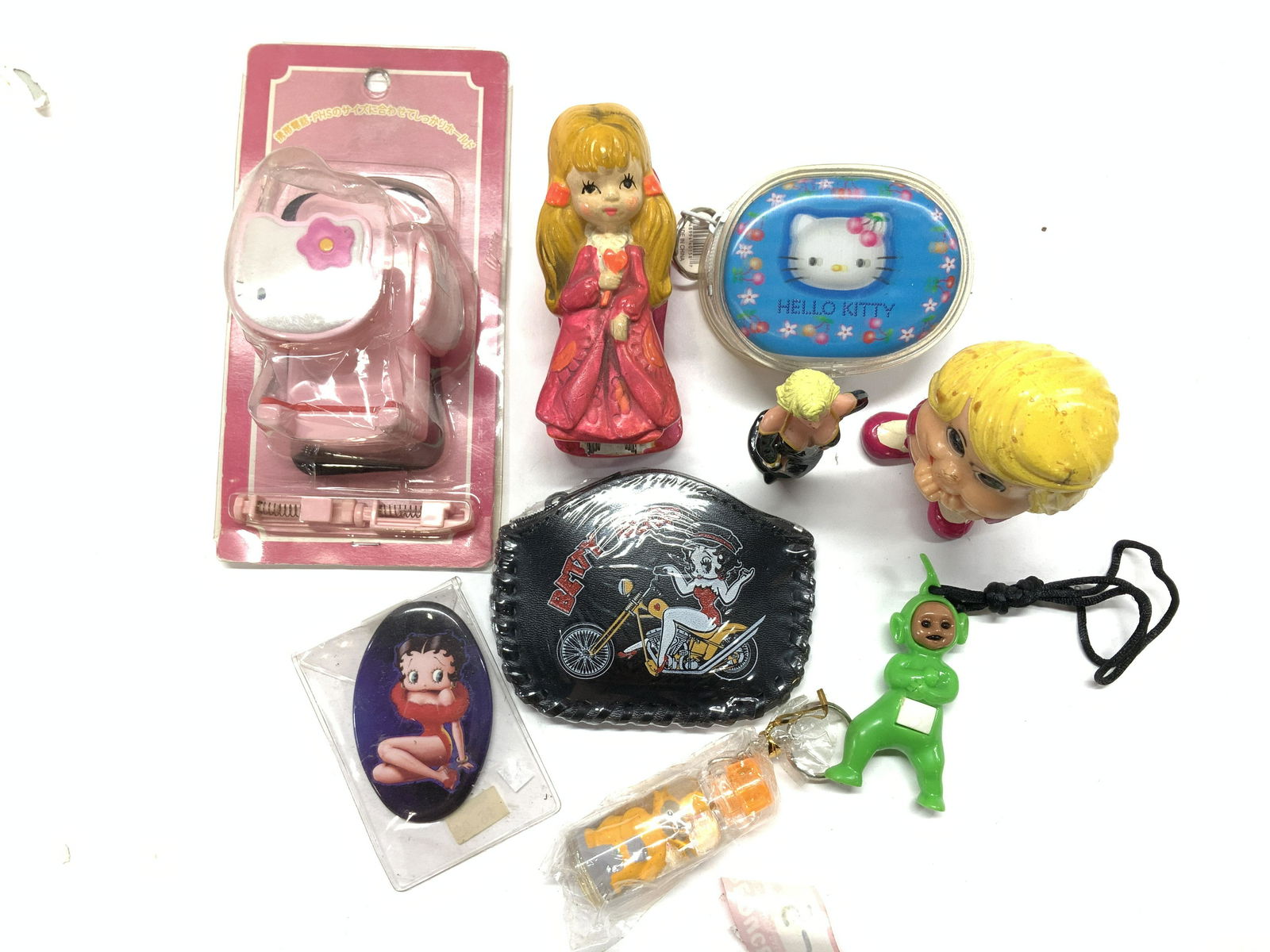 Lot 9 Kids Toys and Accessories, new: Betty Boop Pocket mirror and faux leather coin purse 4x 3 in. Holiday fair Hand Painted Ceramic / plaster girl figural stapler, 4 x 2.5 in. Hello Kitty NIP accessory. Key chain bubbles bottle, hangs a