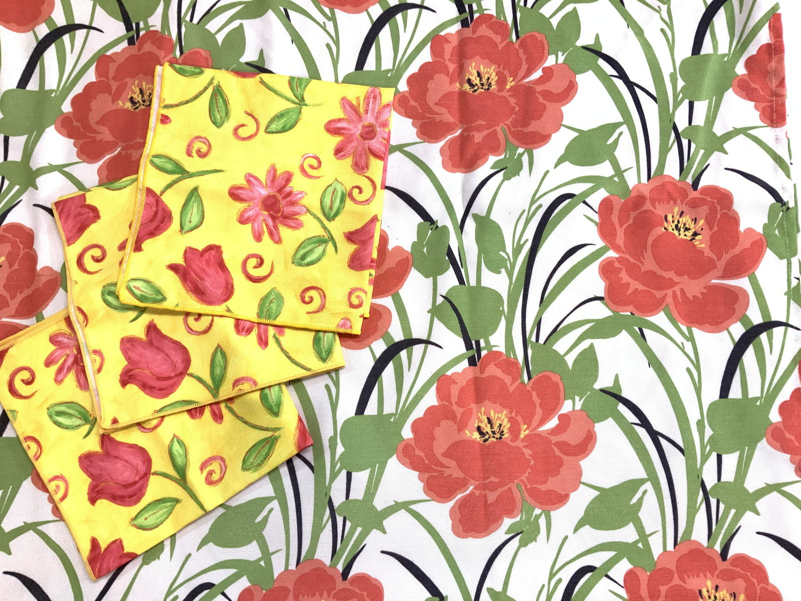 Poppy Flower Tablecloth & Tulip Napkins: Set 3 napkins, yellow with pink tulips and aster flowers, 17.5 x 18 in. Poppy flower tablecloth , 58 x 100 in. Blemishing in areas consistent with use, age, and exposure. Table napery, Tablecloth, Tul
