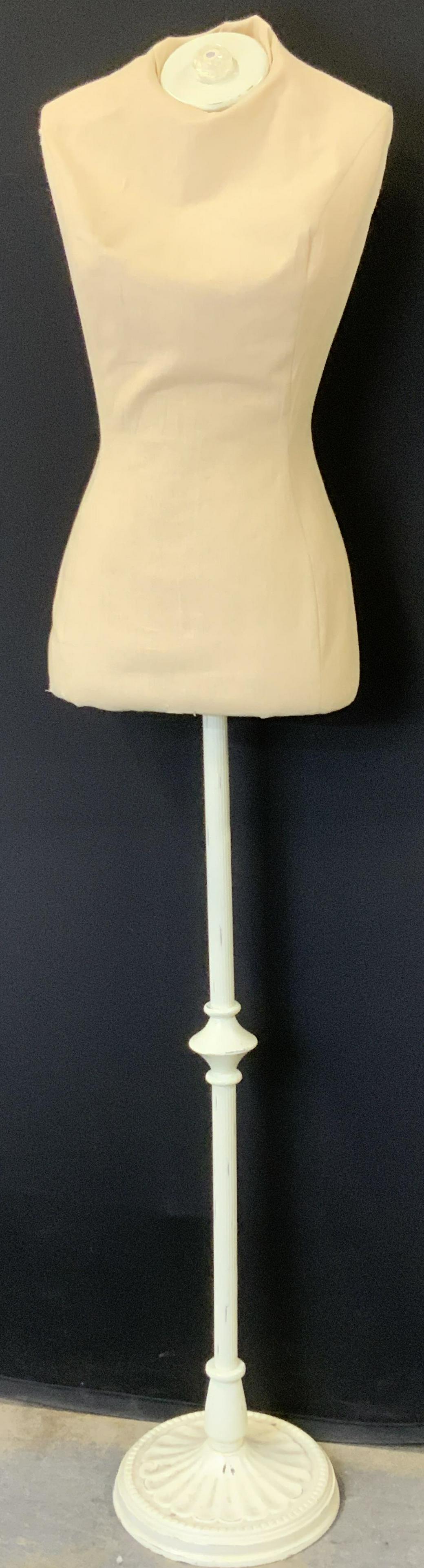 Clothing Mannequin with Iron Stand: Vintage Clothing mannequin, 61 in. Tall, body detentions , 14 in. across shoulder, waist 24.5 in. Hips 34.5 in. Stands on a painted ( antique white) iron pole and stand. Evident wear and damage. At br