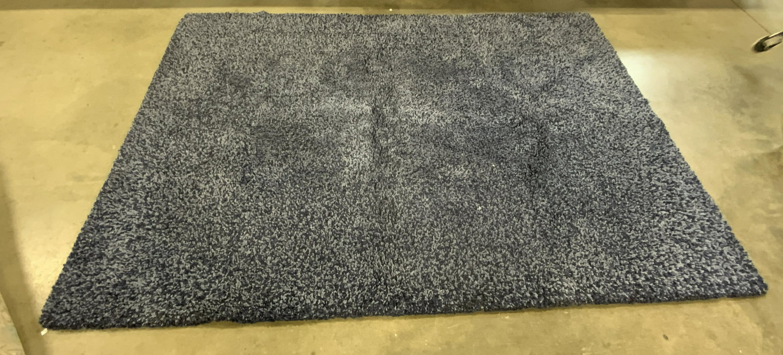 SAFAVIEH SANTA MONICA Navy Plush Rug: A thick plush navy blue hued rug. Tag to reverse reads SAFAVIEH SANTA MONICA. Polyester blend. Measures approx 80W x 116L in. Some wear consistent with use. SAFAVIEH SANTA MONICA Navy Plush Rug, homew