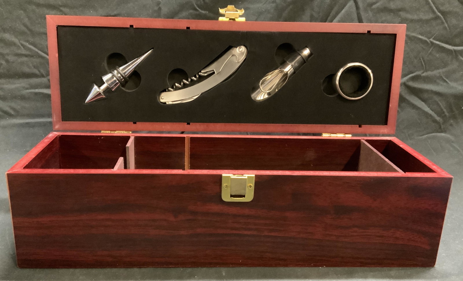 Wooden Barware Accessory Box: Wooden Barware accessory box with bar accessories. Includes bottle stopper, corkscrew, pourer, and other accessory. Some surface wear to pieces consistent with exposure. Sizes of accessories vary. Box