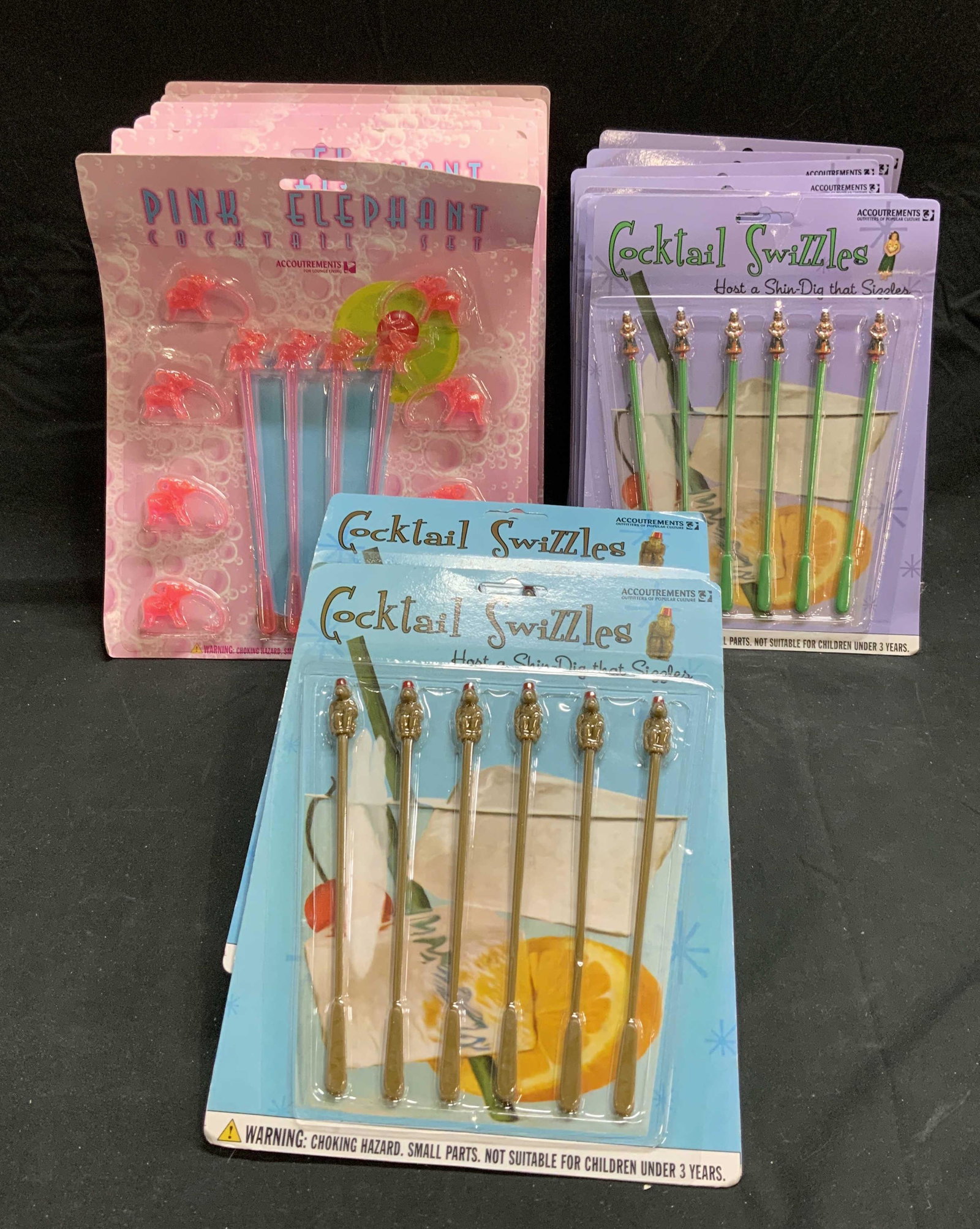 Large Group Cocktail Swizzle Sticks NIP: Large group lot of cocktail stirrers/swizzle sticks. All new in packages. Includes 7 packs of monkey swizzle sticks, 6 packs of pink elephant swizzle sticks, and 11 packs of hula girl swizzle sticks. 