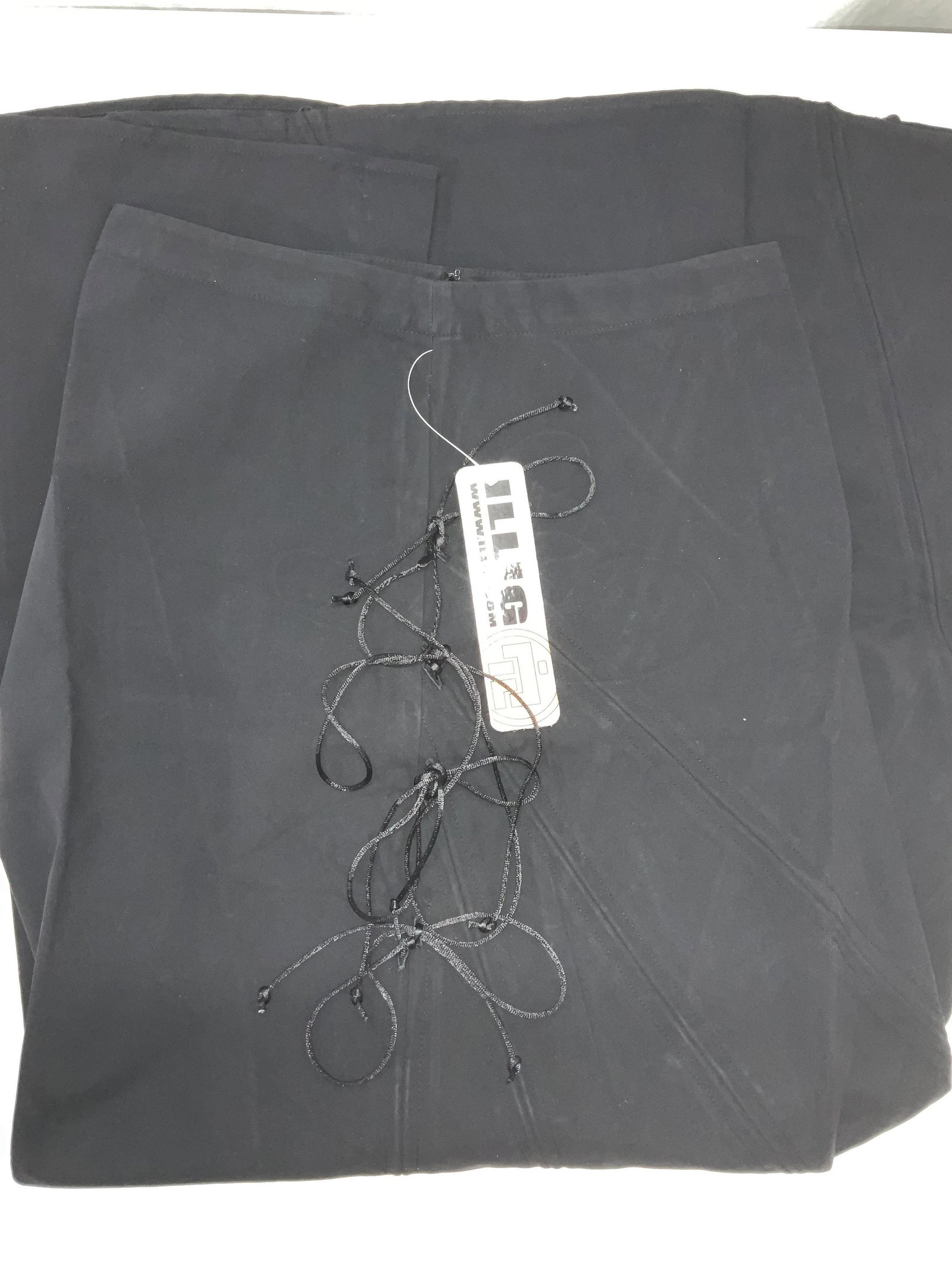 ILLIG Long Black Skirt, NIP: Polyester skirt that feels like faux suede, size XS, new with tag and in original plastic packaging, removed only for photography, Decorative accents tie strings, 41 in. L zipper backside. Skirt, Desi