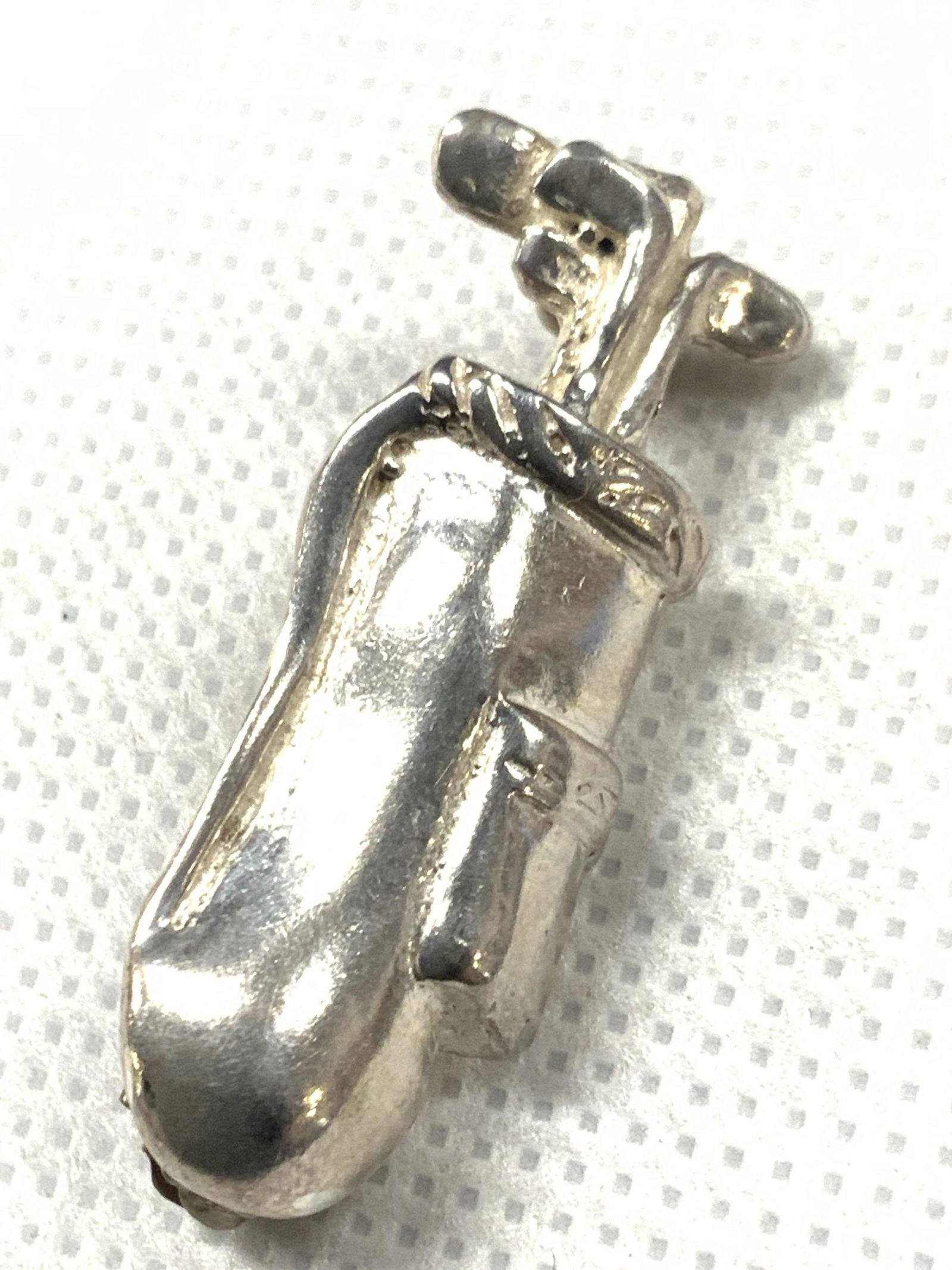 Vintage Sterling Silver Golf Club Bag Lapel Pin: Vintage lapel pin resembling a golf club bag with clubs coming out the top. Tested positive for sterling using Puritest metal tester. Approximately 1.25 inches long Total weight 0.19 ozt Minor wearing