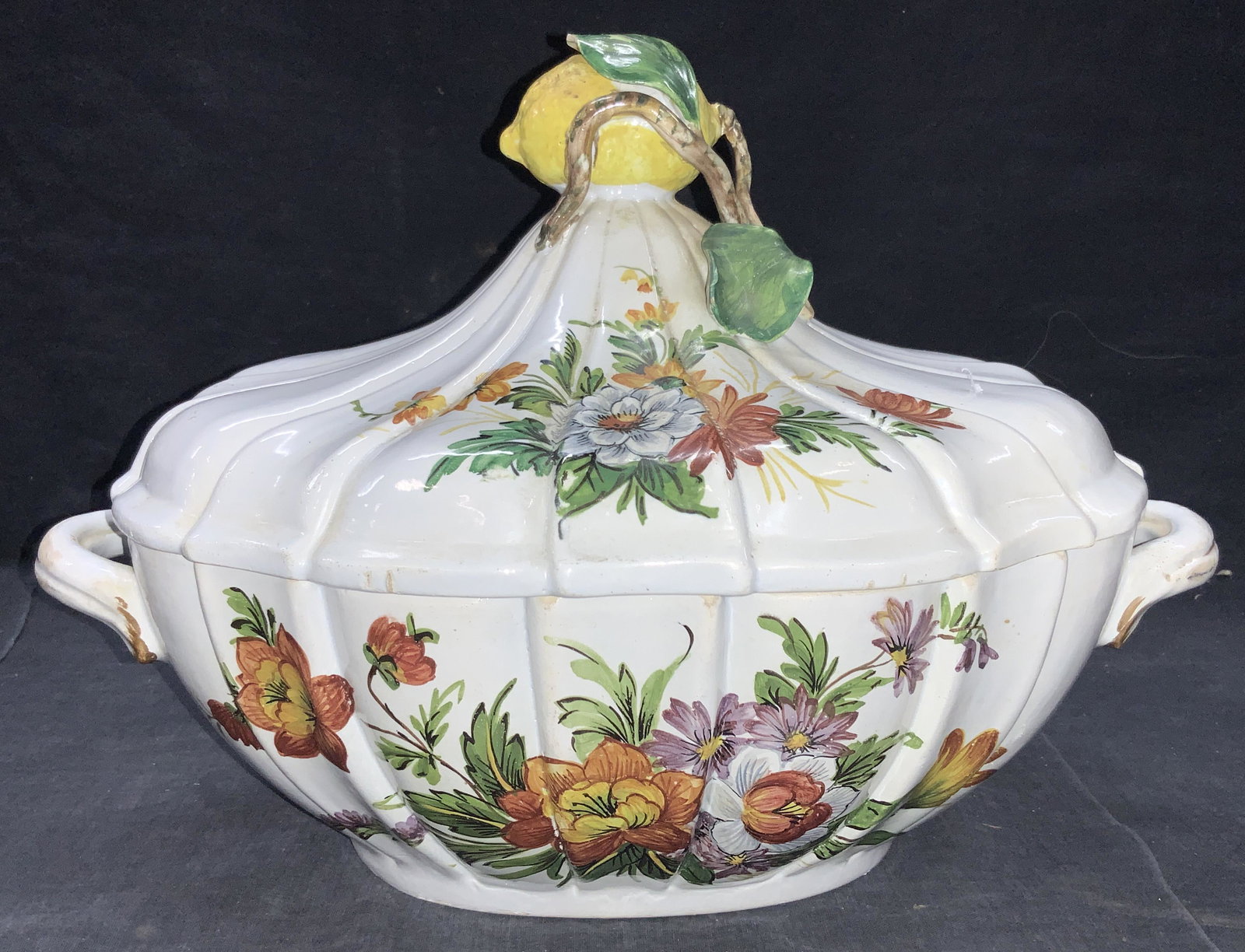 Vintage Hand Painted Porcelain Tureen, Italy: Marked Italy on underside Hand painted with floral motifs on exterior and scalloped shaped top lid. Lid is also hand painted with floral motifs. Top of lid has realistic painted lemon with stem and gr