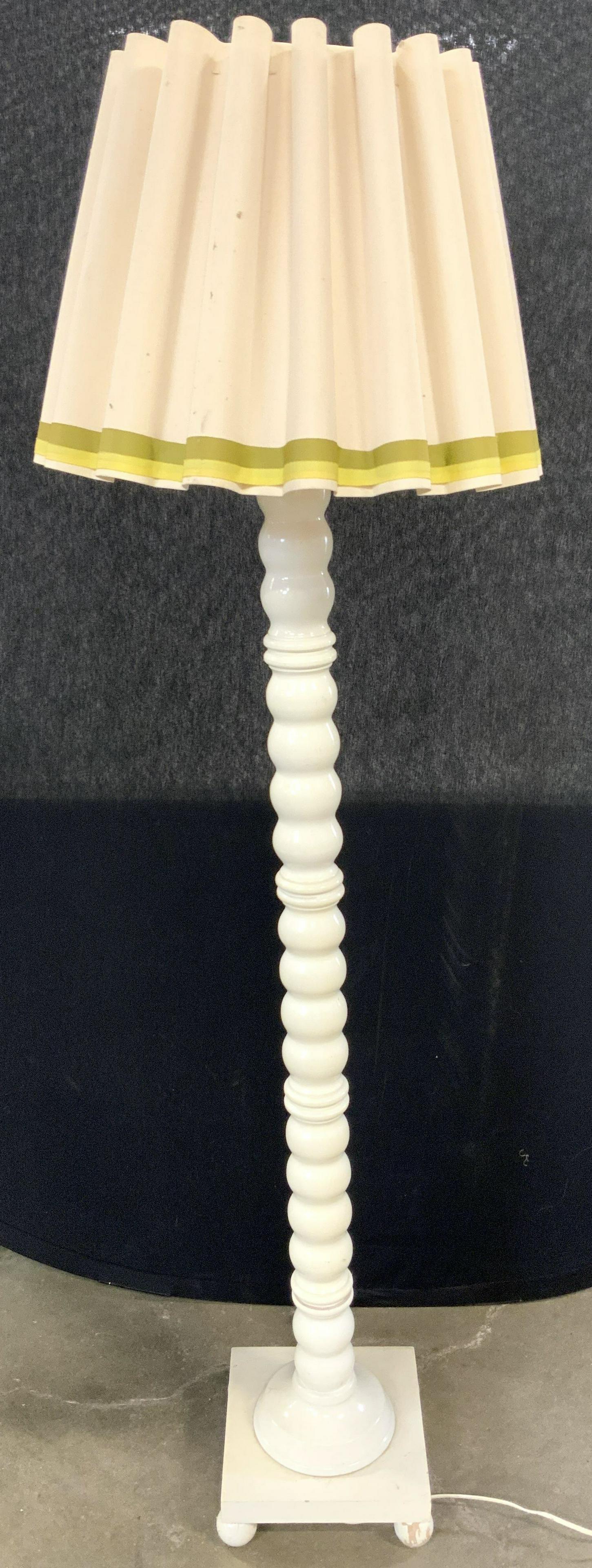 Vntg Footed Wooden Floor Lamp W Pleated Shade: Lamp is vintage. Piece is cream toned & wooden. Base has 4 spherical shaped feet. Shade is pleated with olive & yellow striped detail near bottom. Lamp measures approx 59 inches tall 10.5 inches squar