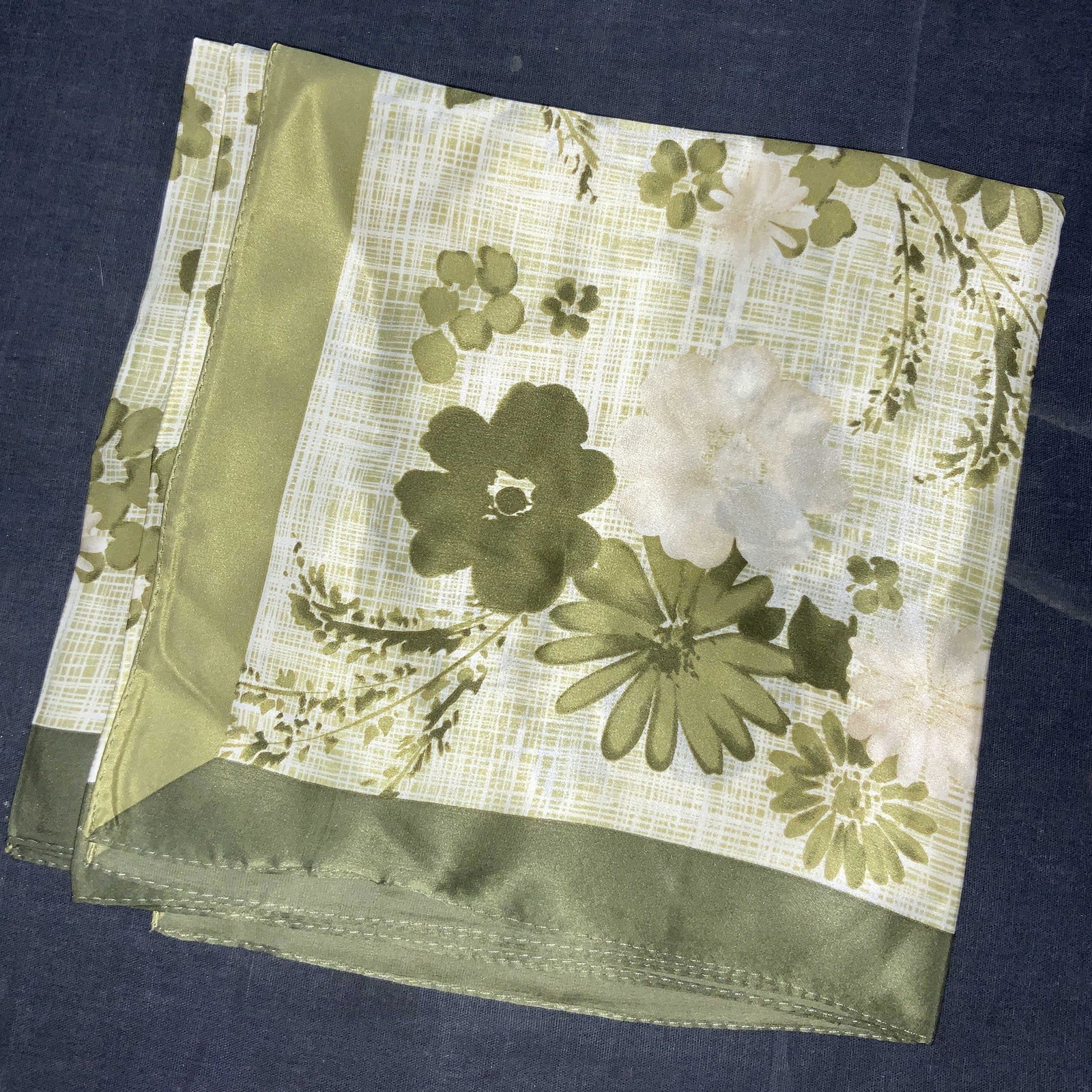 LAURA ASHKEY 100% Silk Rolled Edges Scarf: Marked on tag Laura Ashley, 100% Silk Hand rolled edges with moss green toned boarder and white and green cross hatching in center with floral motifs. Approximately 34 x 34 inches. Laura Ashley Design