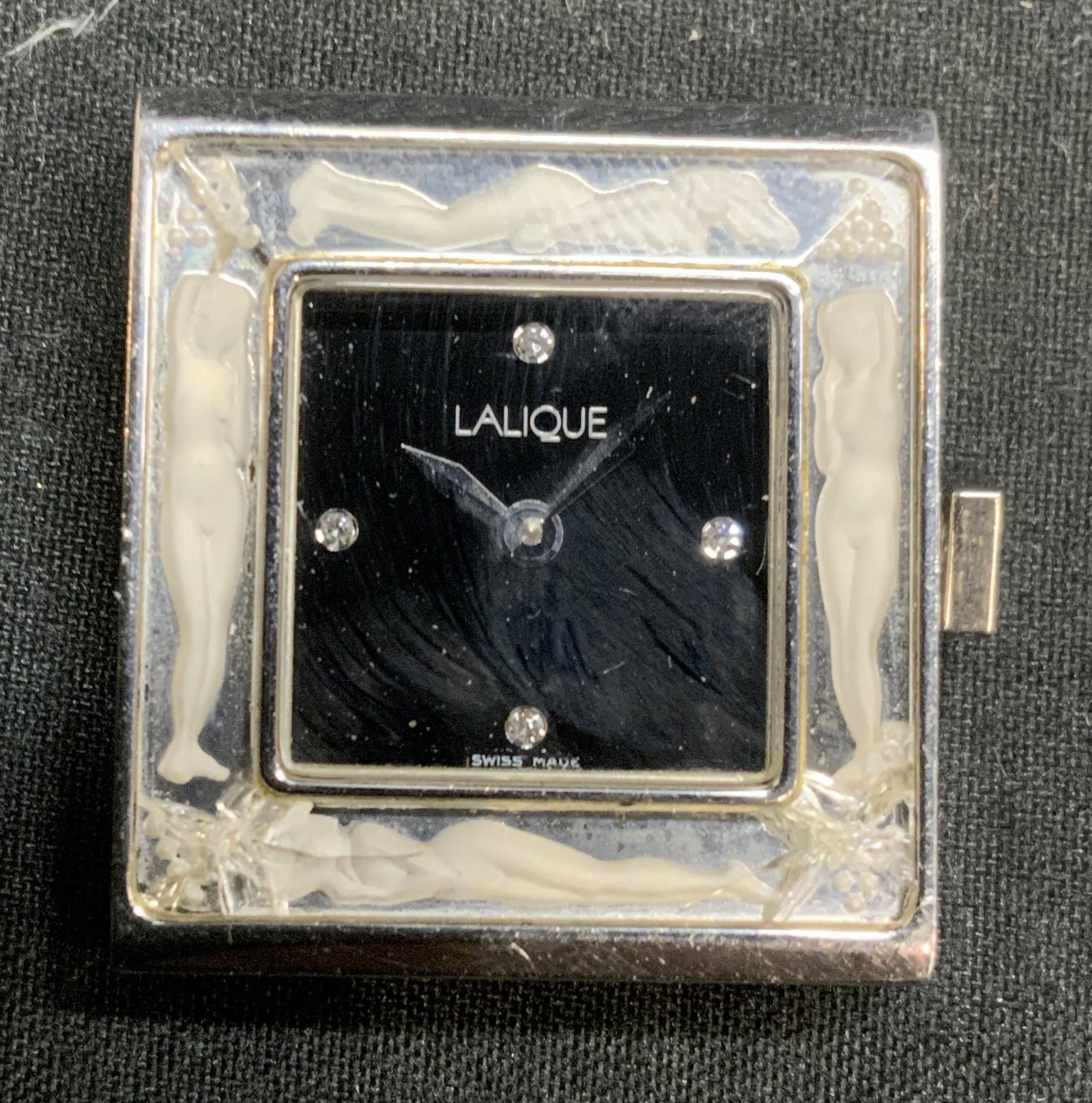 LALIQUE Bacchantes Crystal Watch Face: Lalique Bacchantes stainless steel watch face with crystal decoration and figural motif on border. Backing is loose, some cracking observed. Trademarked to underside. Swiss made. Marked WR30M, 14822 0