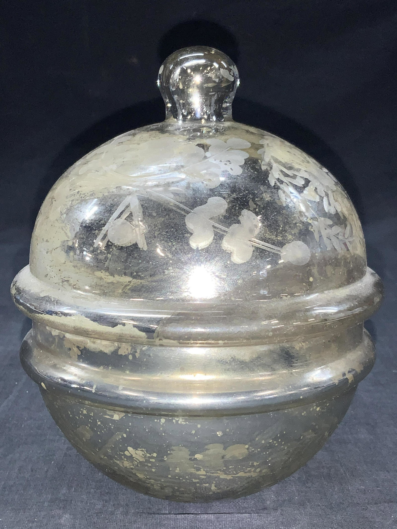 Vintage Covered Glass Candle Holder W Candle: Vintage candle holder, made of glass with lid and floral motifs on exterior, orbital in shape with scented candle on interior. Approximately 7 inches tall and 4.75 inch diameter. Evident surface wear 
