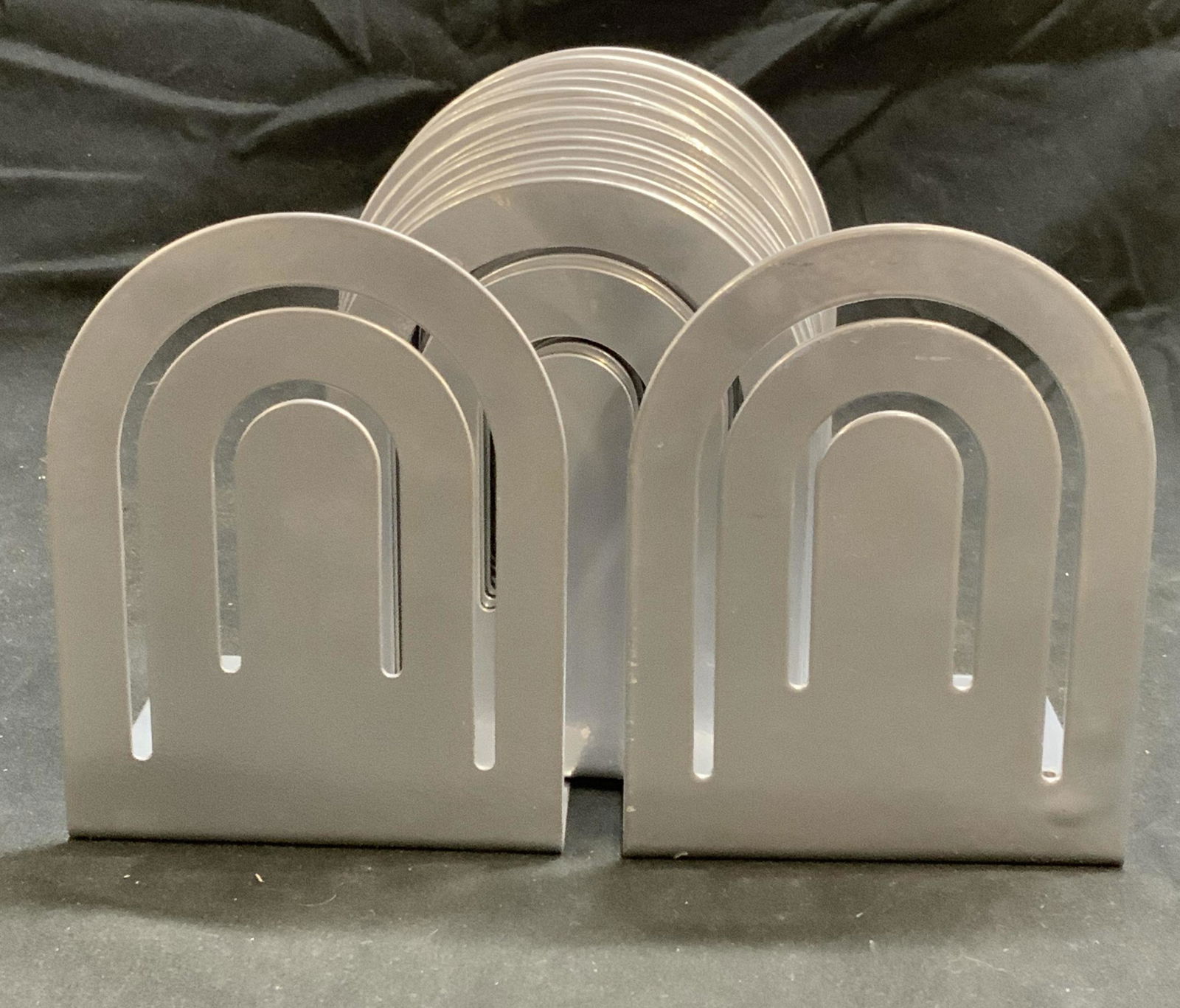 Set 16 SPECTRUM DIV DESIGNS Silver Tn Bookends: Set of 16 Spectrum Div. Designs silver tone metal bookends. Trademarked to underside. Some surface wear consistent with exposure. Pieces have weight. Measure approx. 3.5 x 3.5 x 4.5 inches. Spectrum d