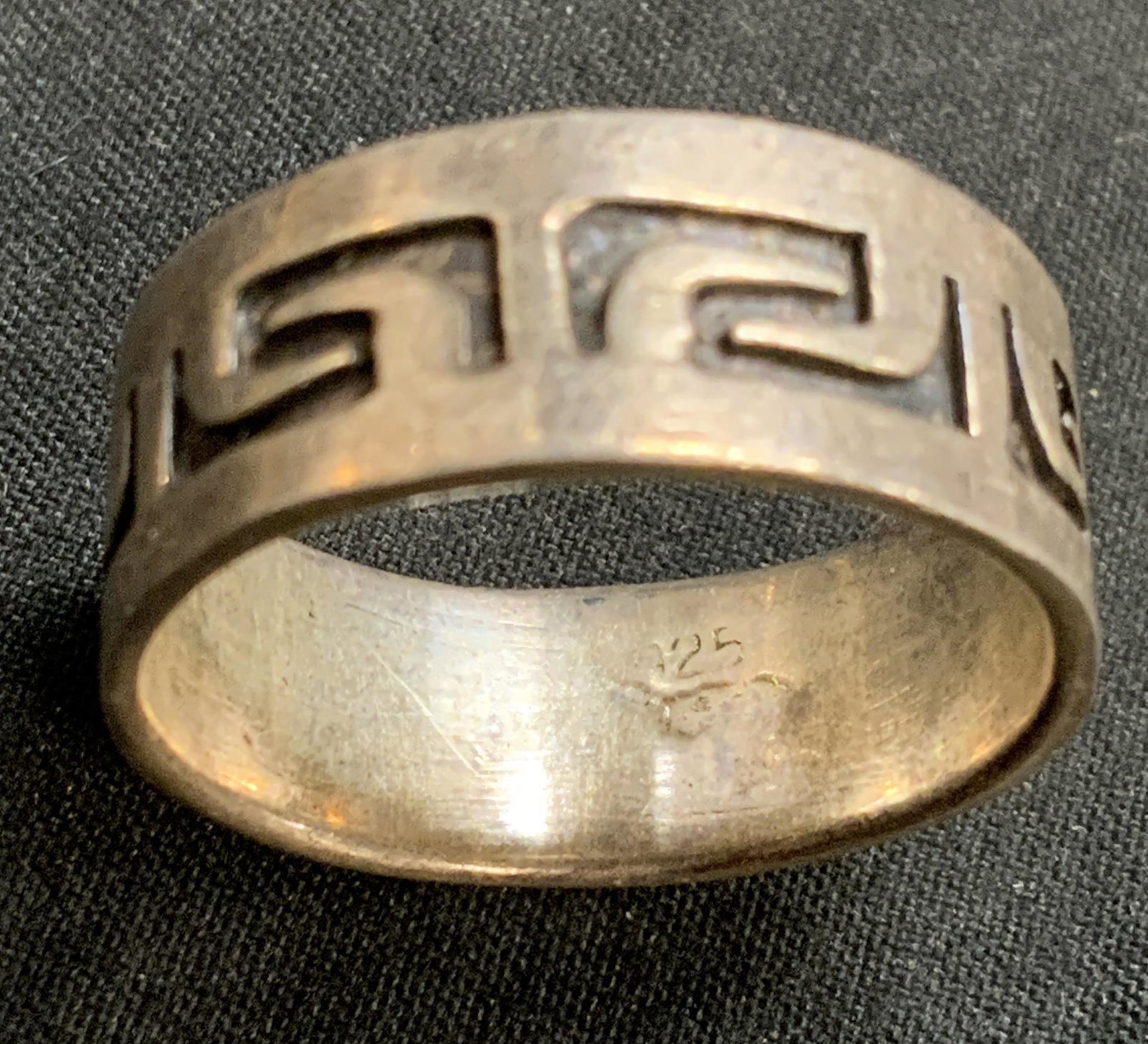 STERLING SILVER Etched Band Ring: Sterling silver ring with etched decoration on band. Band width approx. 3/8 inches. Ring size 9.5. Surface wear consistent with exposure. Marked 925 to interior band. Total weight .17 ozt. Estate jewe