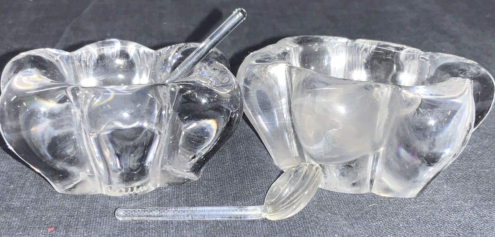 DAUM France Hallmarked Glass Floral Salt Cellars: Hallmarked on sides, appears to read Daum. 2 frosted glass floral inspired salt cellars with glass made shell inspired spoons. Cellars are approximately 1.25 inches tall and 2.25 inches long, spoons a
