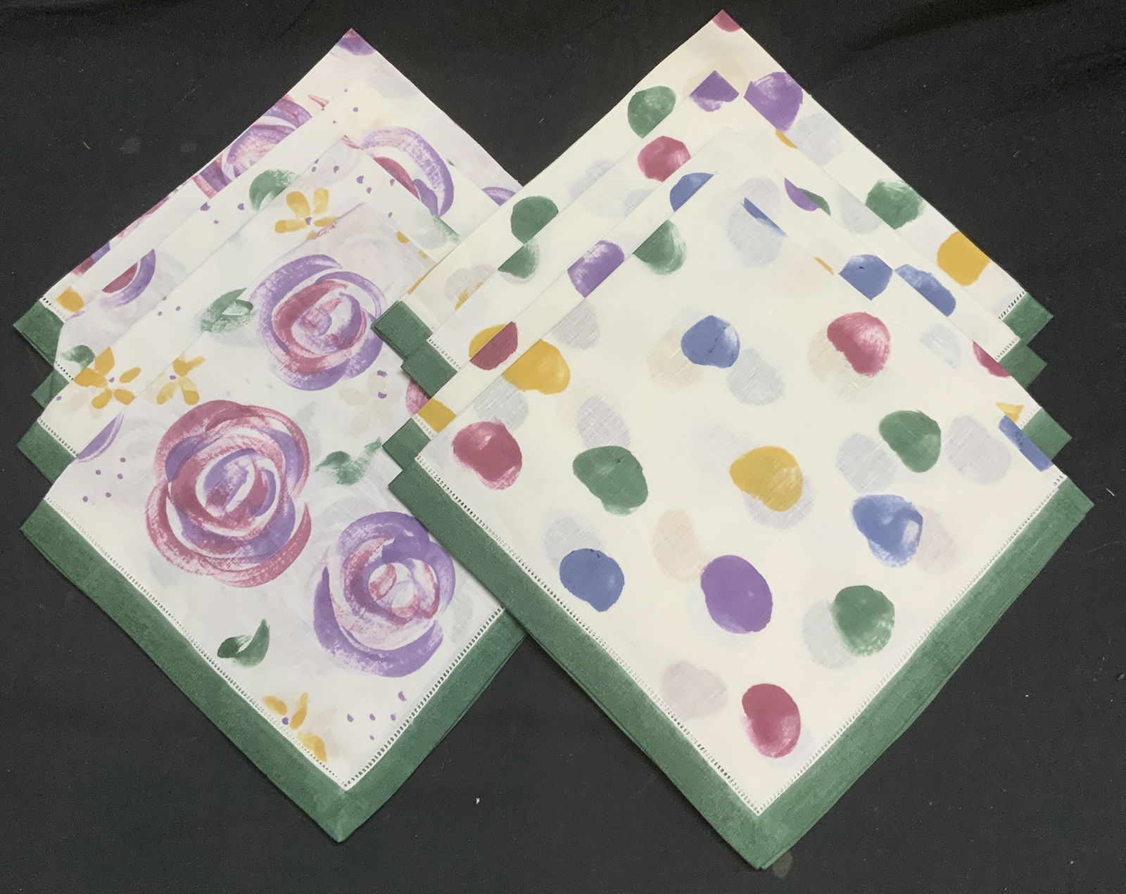 Set 8 Floral & Dot Print Cotton Napkins: Set of 8 floral and dot printed cotton dinner napkins with green borders in hues of burgundy, yellow, purple, blue, and white. 4 with floral print and 4 with dot Measure approx. 21 x 20 inches each. I
