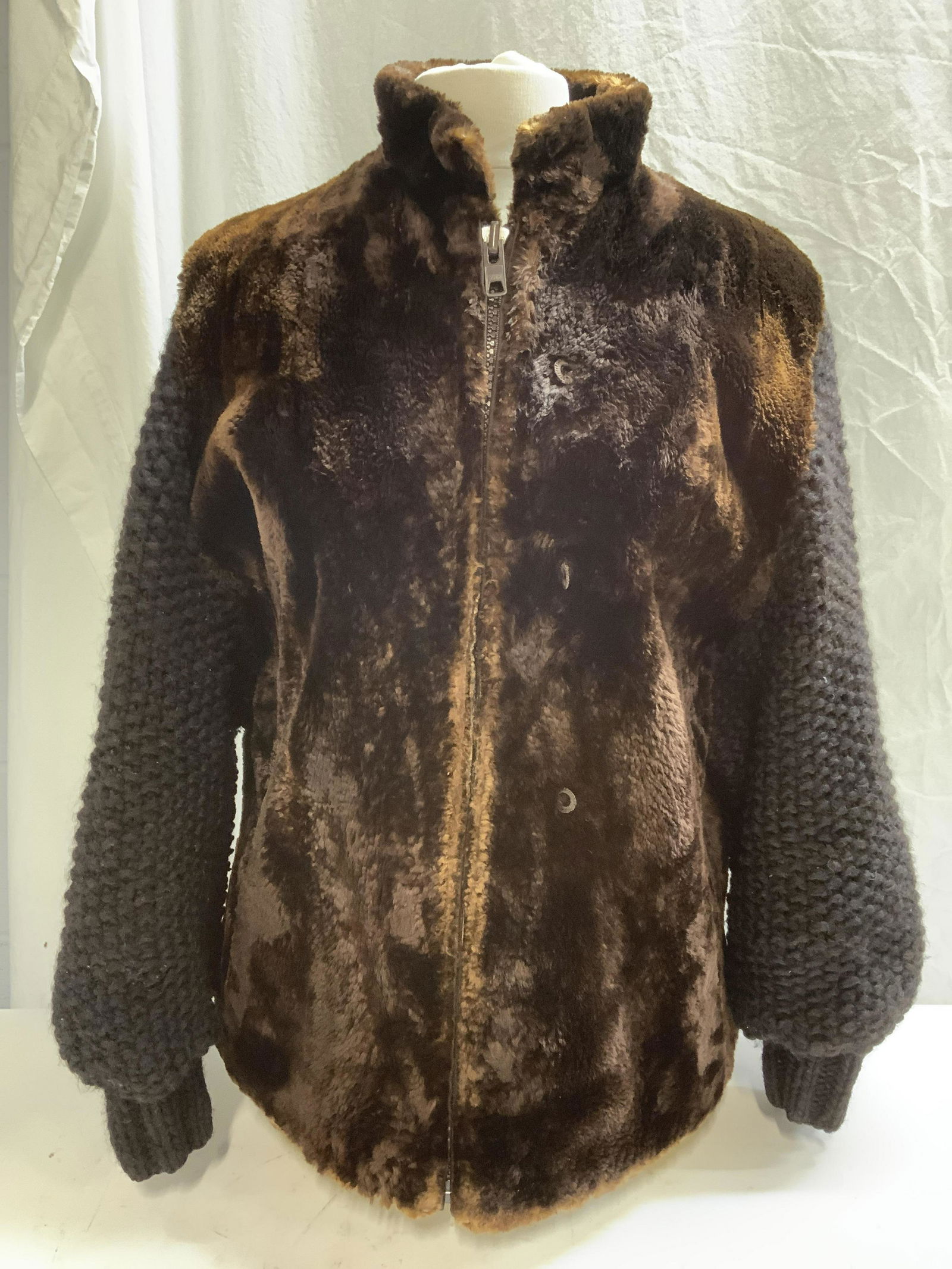 KRAMERS Brown Mink & Wool Zippered Coat: KRAMERS New Haven brown mink coat with knit black wool sleeves. Front zipper closure and hidden hook closure. G some wear to material consistent with exposure. Measures approx. 17 inches across chest.