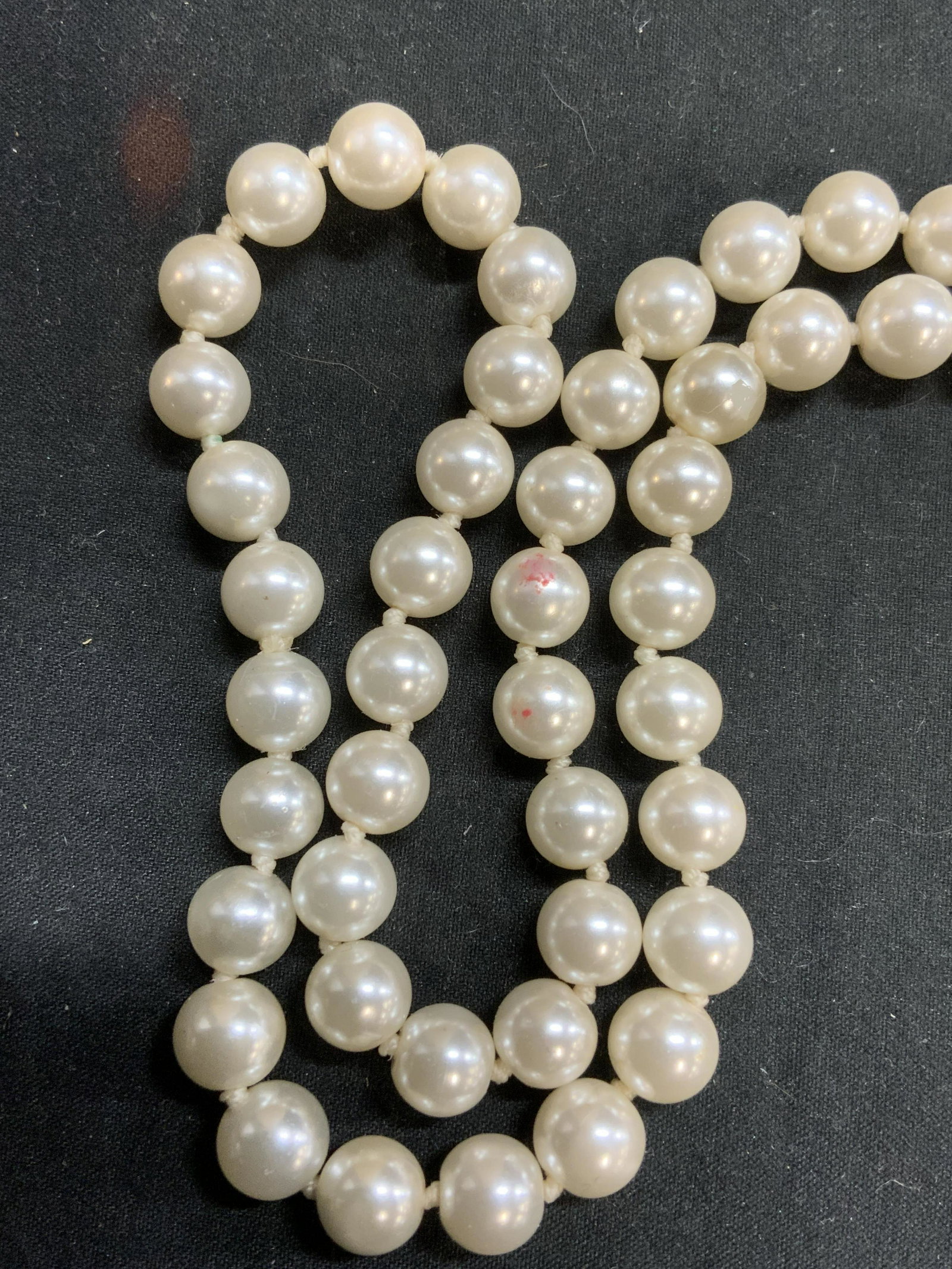 Faux Pearl Beaded Strand Necklace, Jewelry: Faux pearl beaded strand necklace on double knotted string. Measures approx. 43 inches long. Some surface wear consistent with exposure. Property of Palm Beach, Florida estate. Estate jewelry, costume