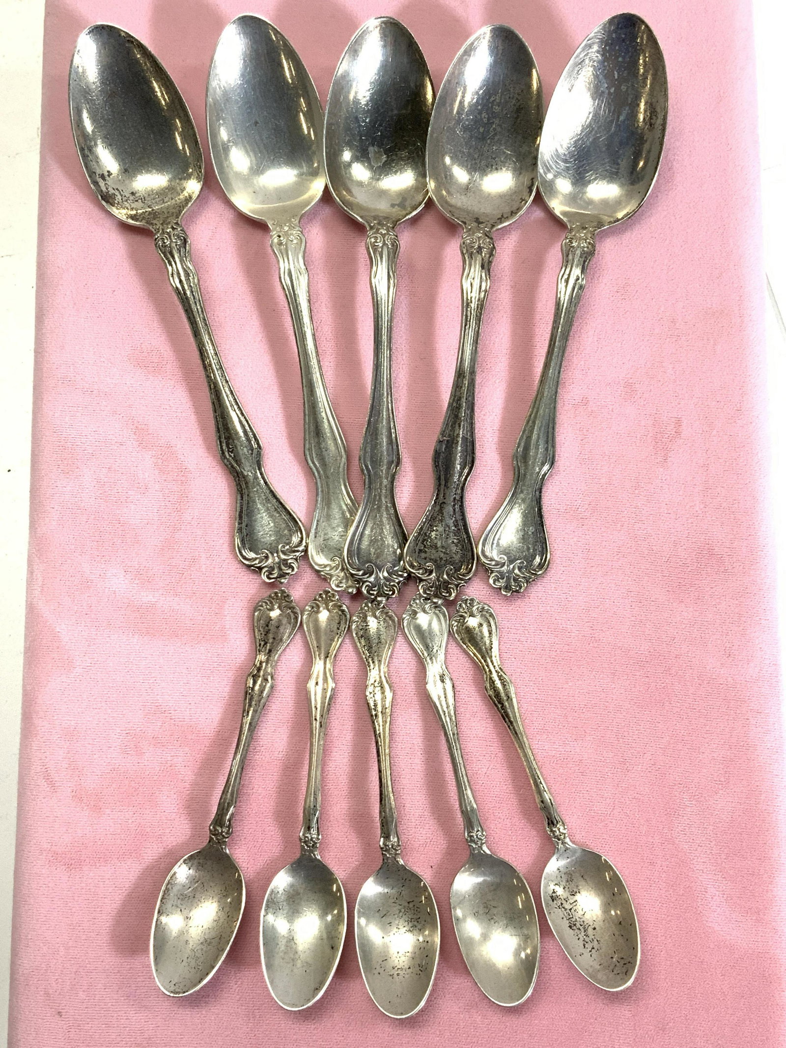 Westmorland Sterling Sil Demitasse & Teaspoons 10: Set of 5 demitasse and 5 teaspoons, all signed Westmorland and Sterling, all from the same pattern. Scalloped Victorian handle with scroll tops. Demitasse measures 4 in. L, Teaspoons measure 6 in. L 5