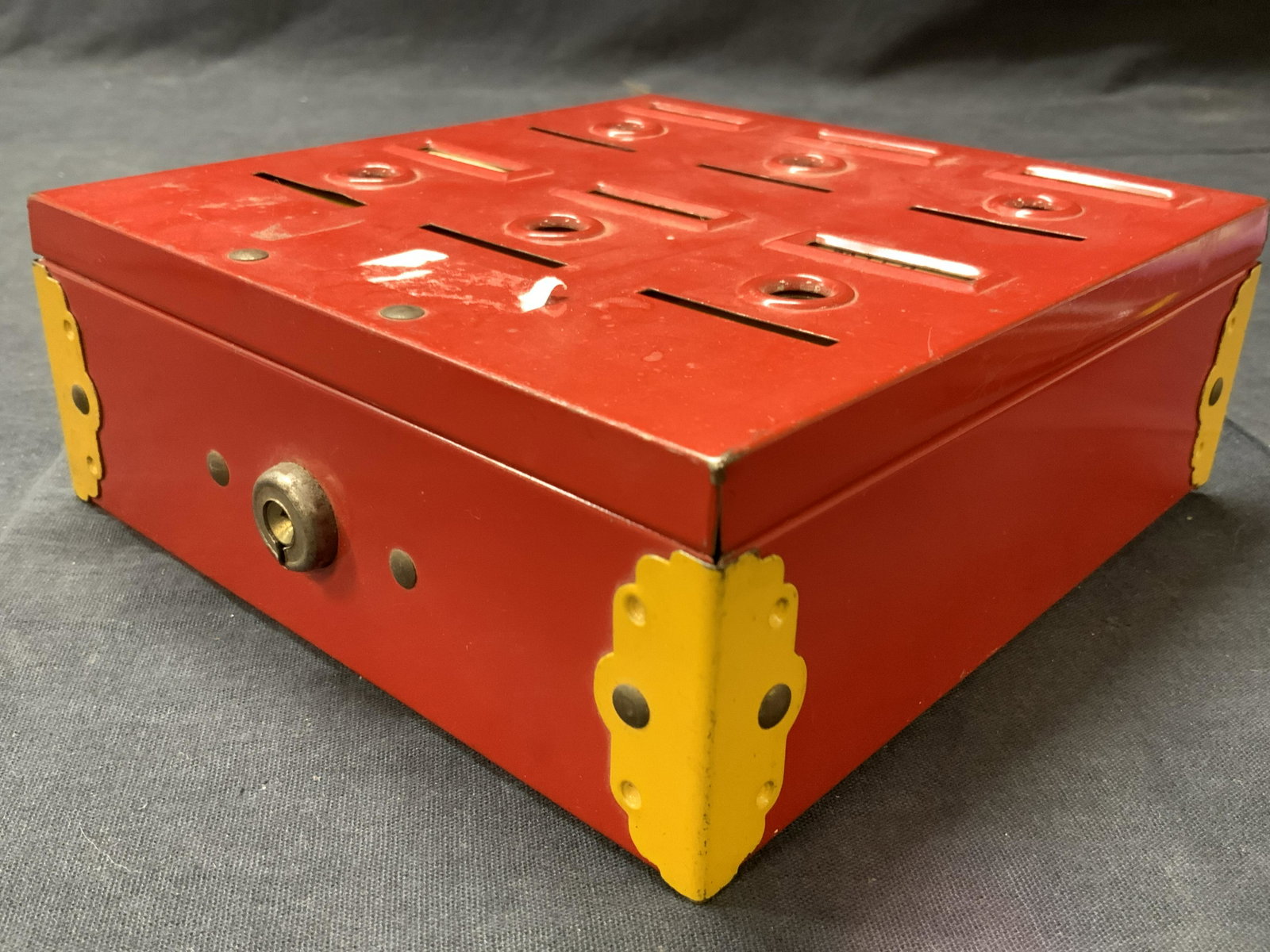 Antique Home Metal Budget Bank: Antique, possible vintage home bank. Marked on backside Home Budget Bank Tudor Metal Prod.Corp. Red metal with smaller yellow metal compartments for coins. Approximately 6 x 6 x 2.25 Inches. Evident w