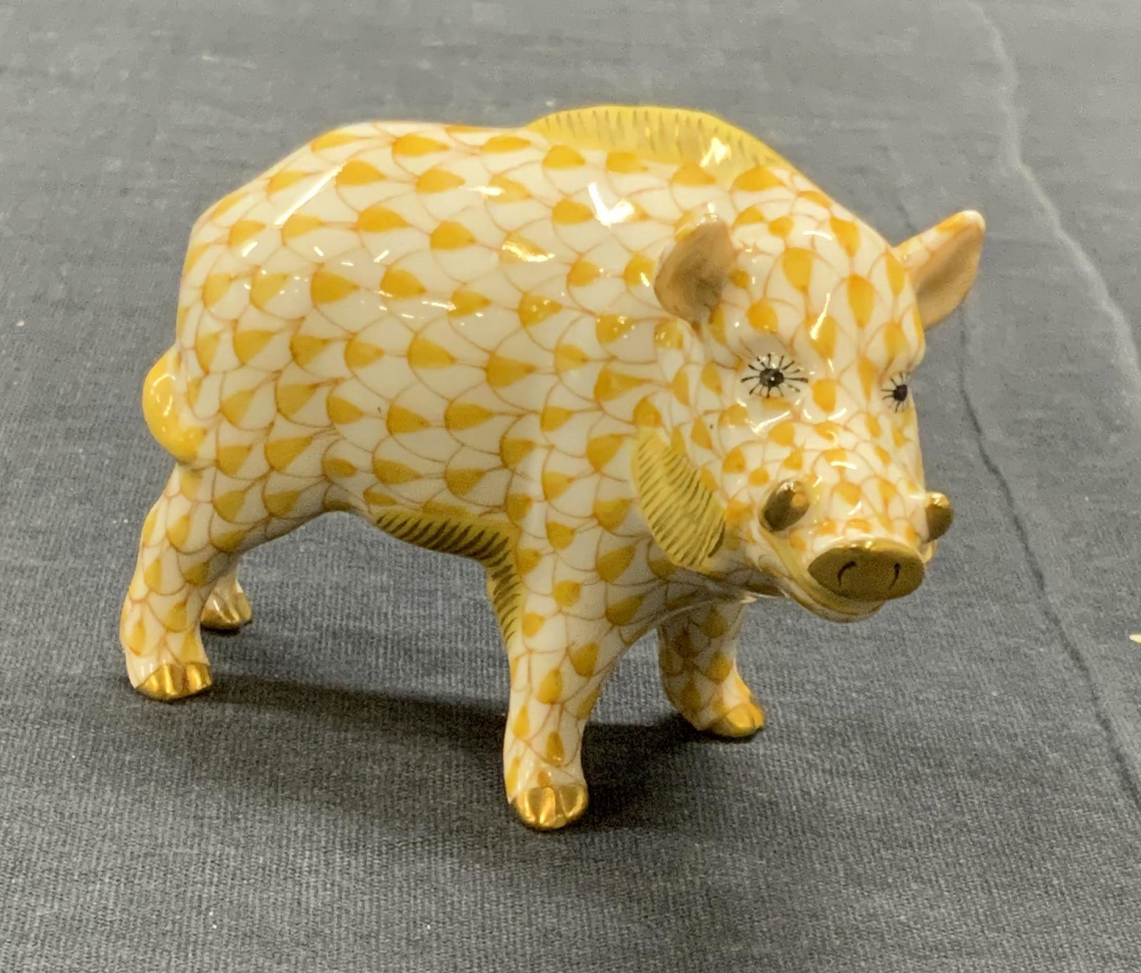 HEREND Hungary Porcelain Fishnet Boar Figurine: Herend hungary porcelain boar figurine in fishnet pattern. Hues of yellow with gilt decoration. In good condition. Trademarked to underside. Measures approx. 3.5 x 1.75 x 2.5 inches. Herend, herend hu
