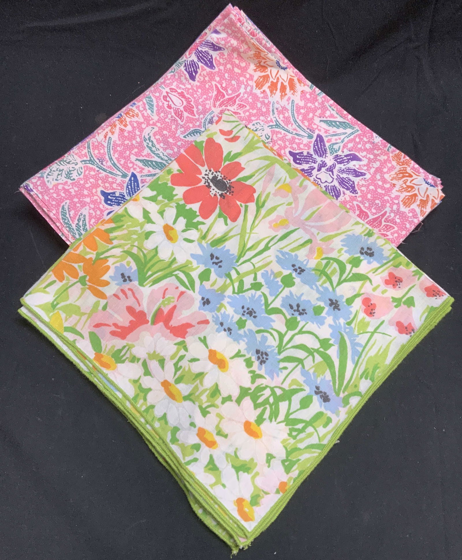 Group 11 Green & Pink Floral Dinner Napkins: Group of 11 green and pink dinner napkins with floral motifs. 3 green and 8 pink. Pink napkins labeled cotton, green napkins feel like cotton. Measure approx. 19 x 19 inches each. Some blemishes to fa
