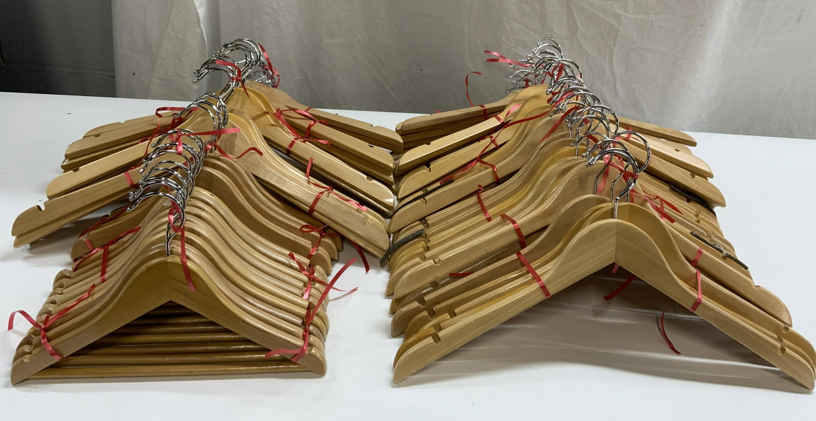 Set 70 Children & Adult Size Wood Hangers: Set of 15 child size wood hangers. Measure approx. 12 x 8 inches each. Set of 55 adult size wood hangers. Measure approx. 17.5 x 8.75 inches each. All pieces have some surface wear consistent with exp